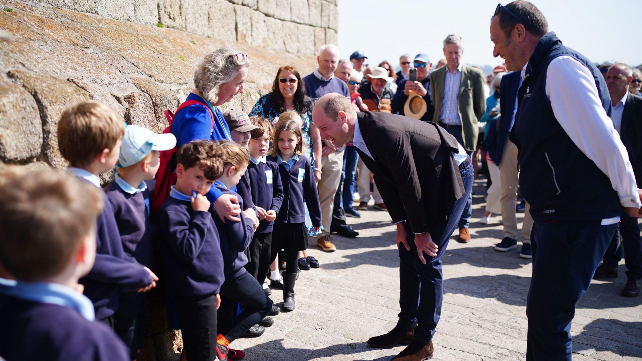 Prince William speaking to young pupils