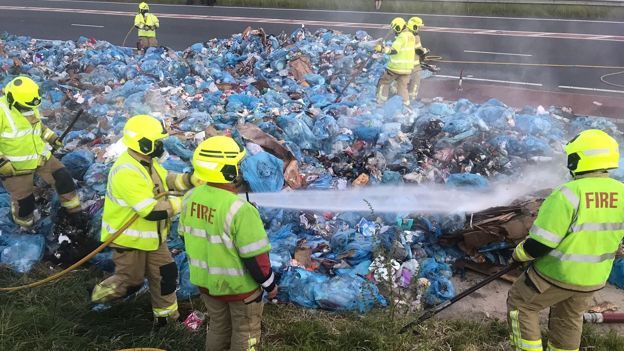 Firefighters emptied the rubbish onto the road to make sure it was out