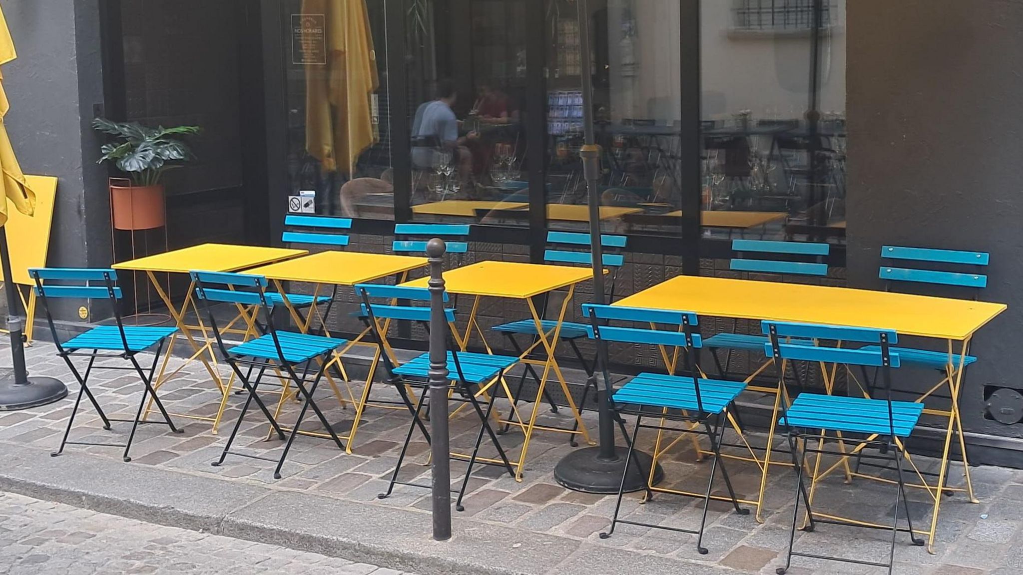 A row of empty restaurant tables