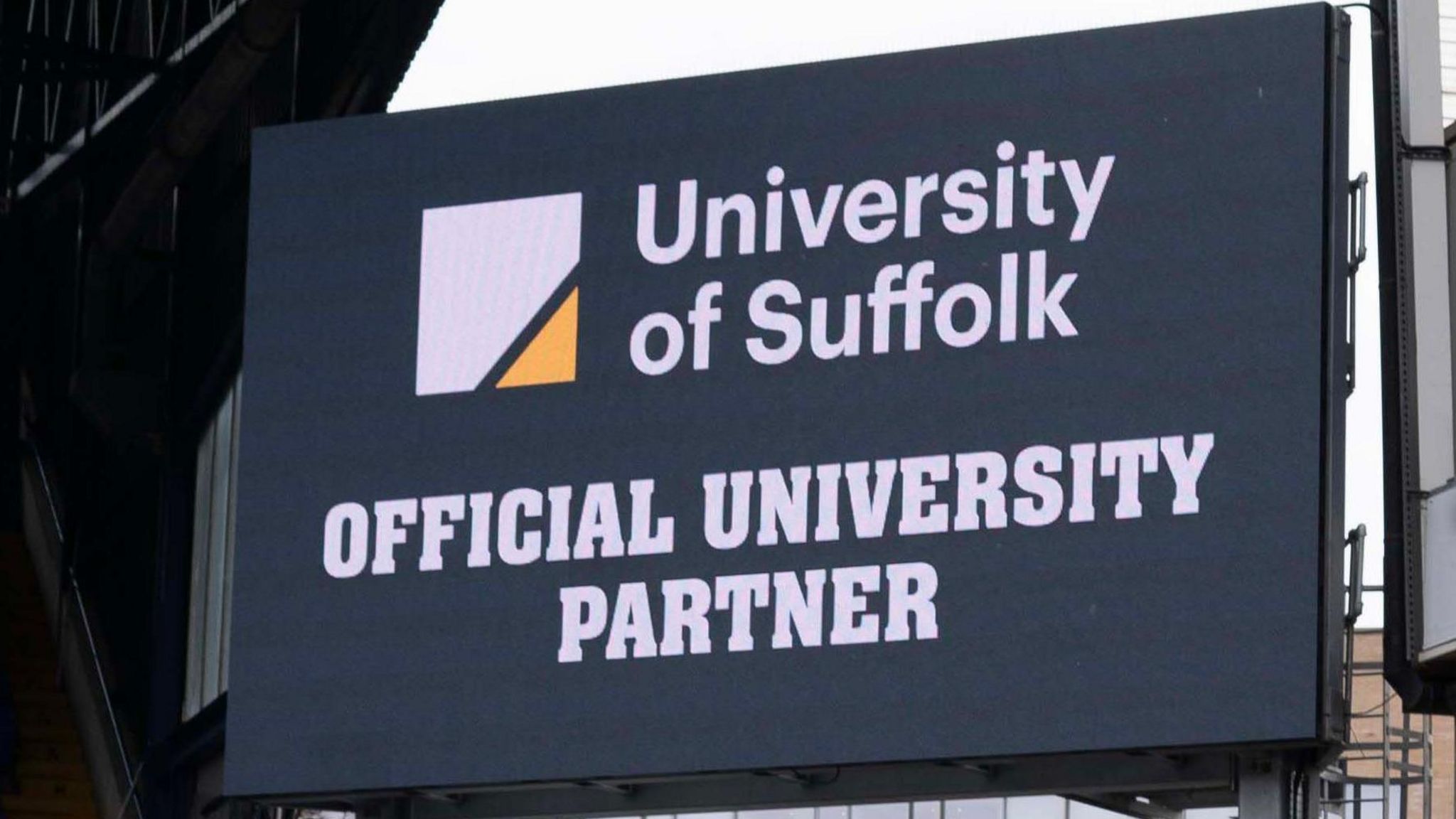Sign showing the club's official university partner