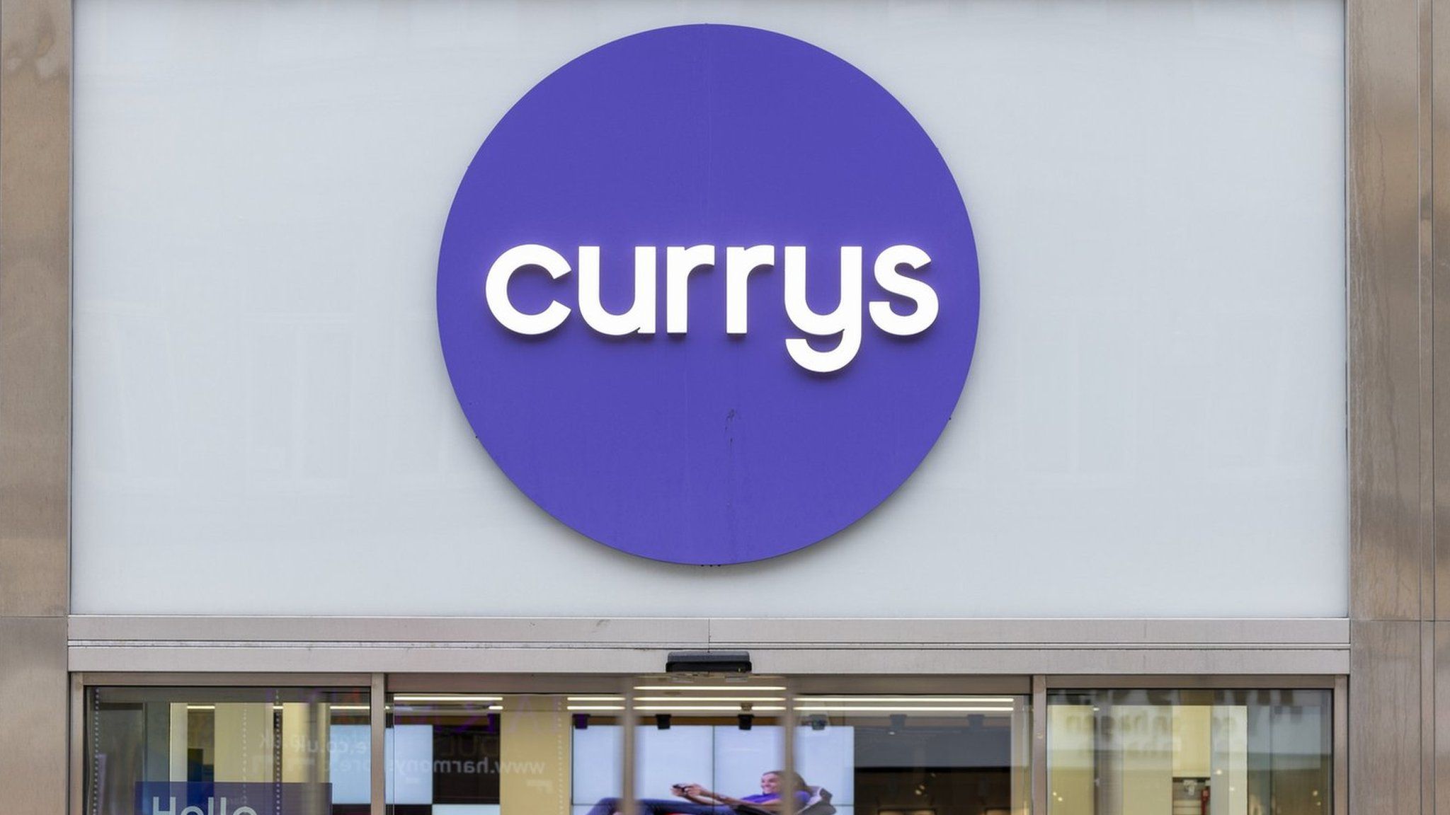 A person walks past Currys