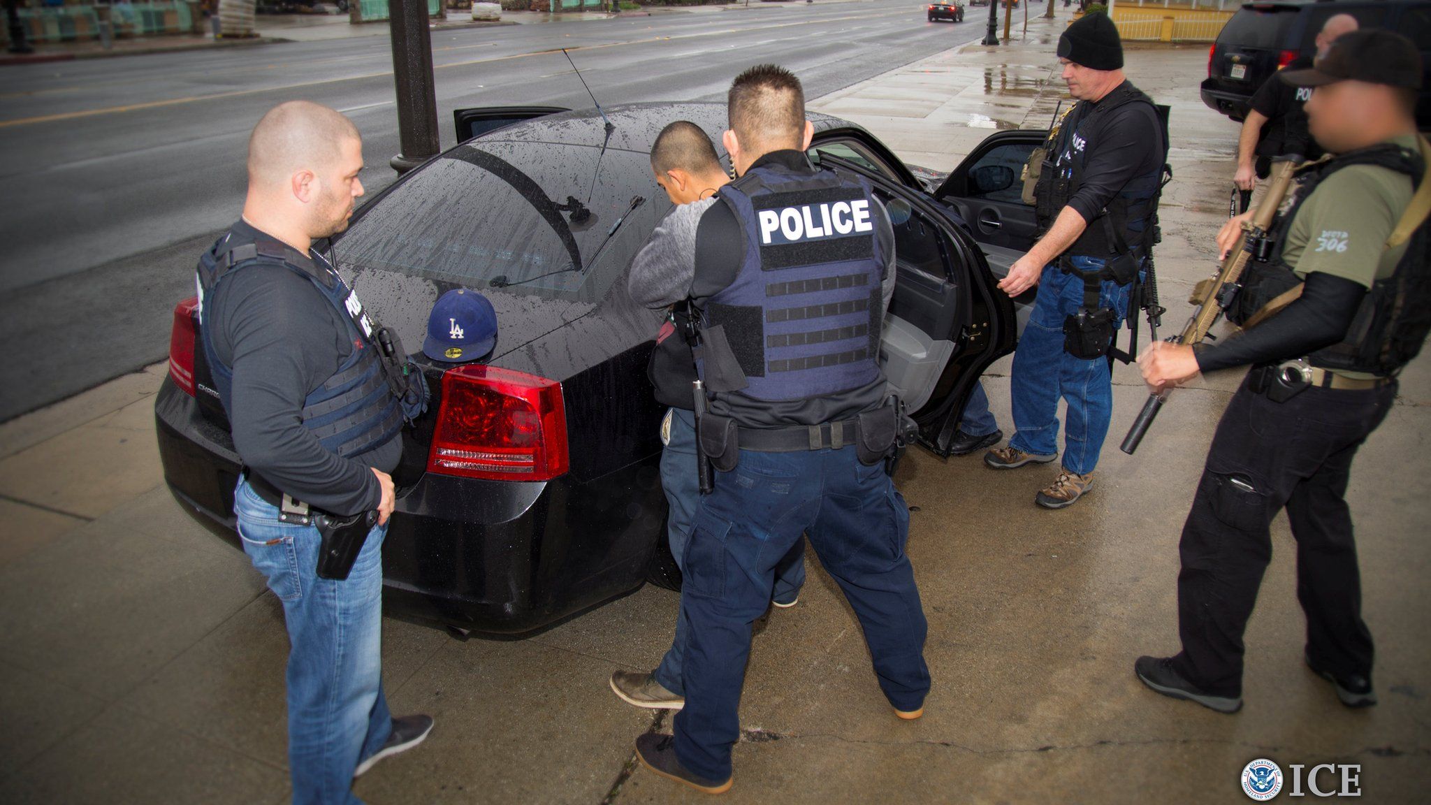 US Immigration and Customs Enforcement officers detain a suspect in Los Angeles