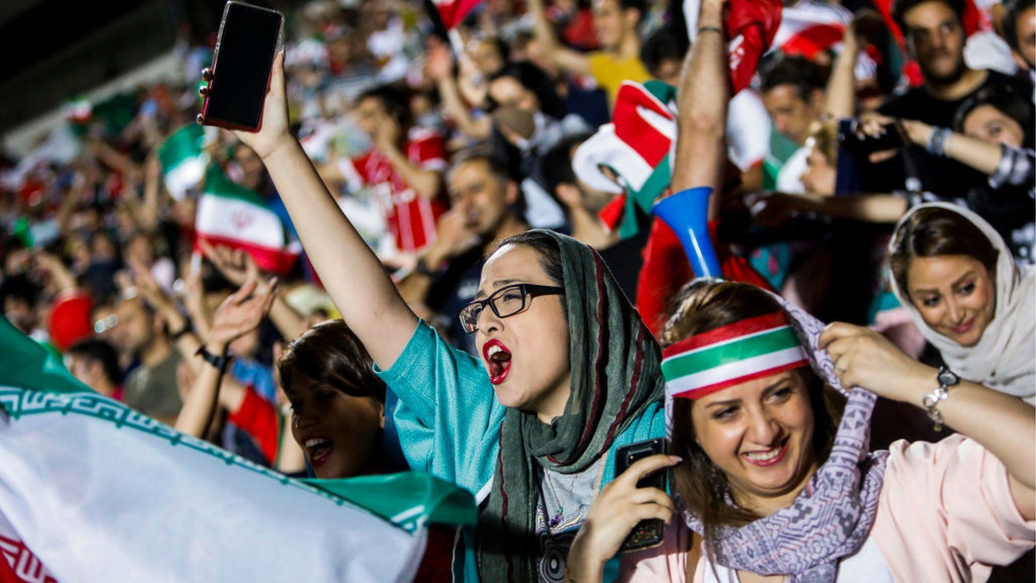 Iranian football supporters during screening of football match between Iran and Spain in Azadi stadium in the capital Tehran on June 20, 2018