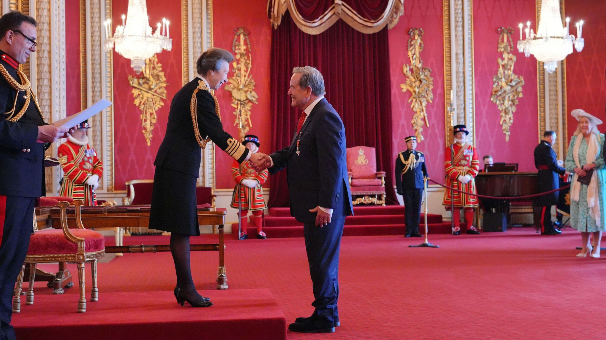 Jeff Stelling shaking hands with the Princess Royal at Buckingham Palace as he is made MBE