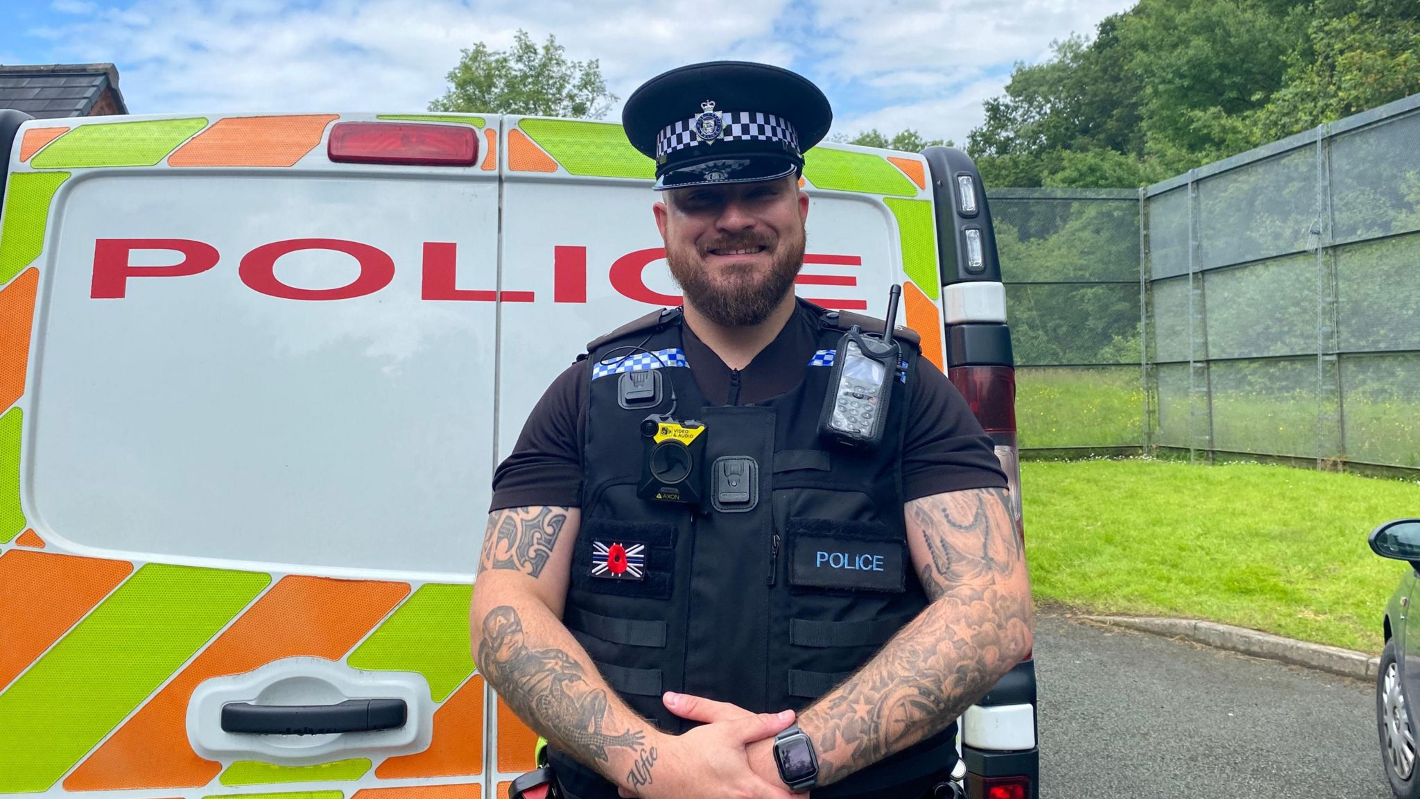 PC Ash Doignie standing in front of a police van