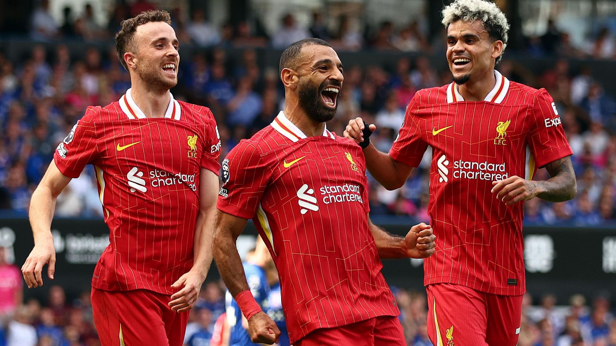 Mohamed Salah celebrates with his Diogo Jota and Luis Diaz after doubling Liverpool's advantage at Portman Road