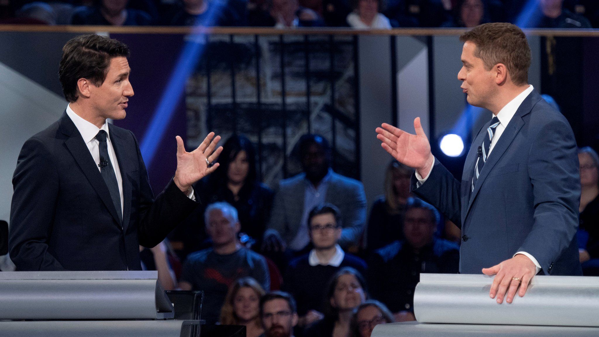 Justin Trudeau, left, and Andrew Scheer exchanging words in a televised election debate on 7 October 2019