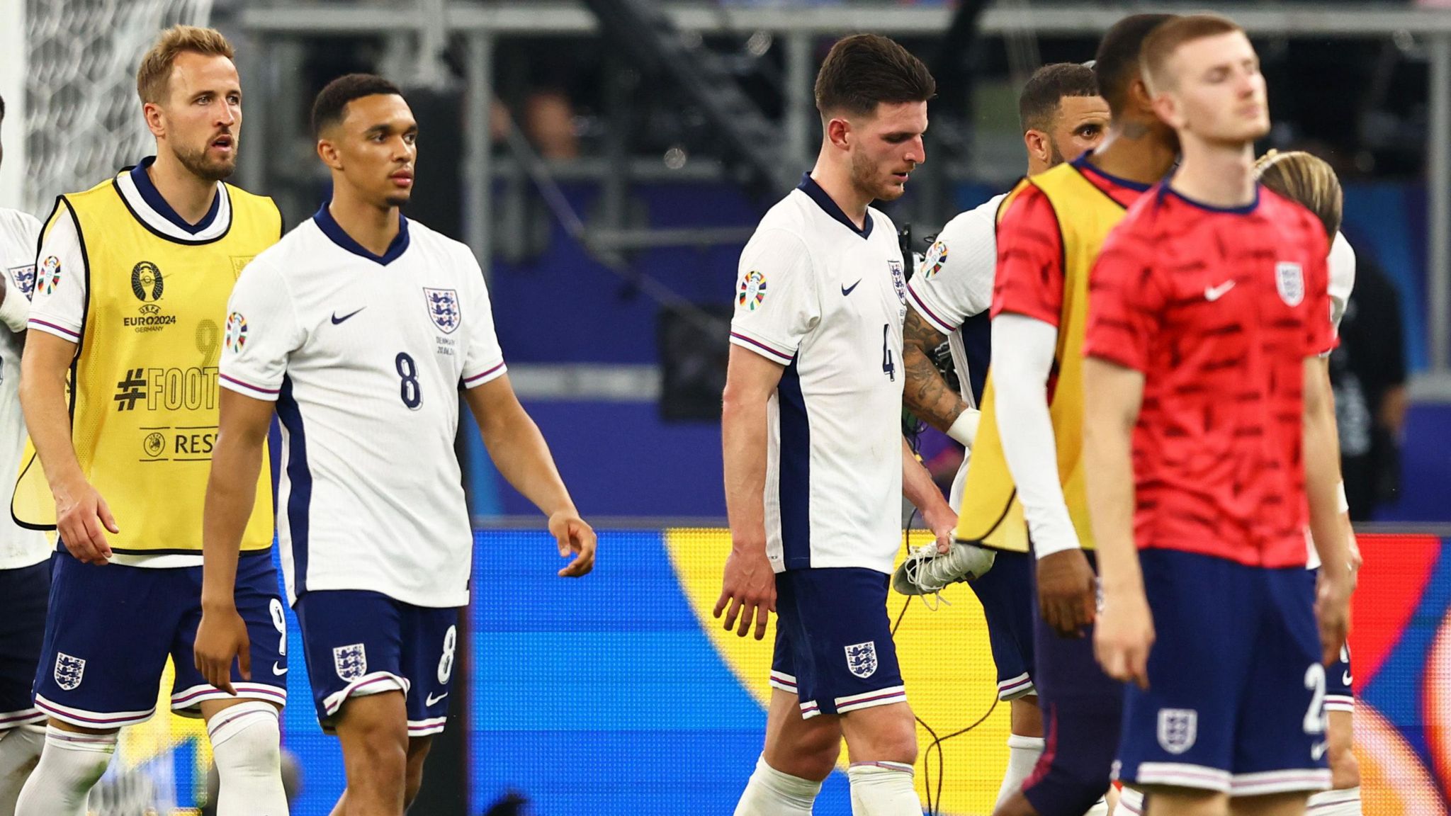 England's players troop off after the disappointing Euro 2024 draw with Denmark