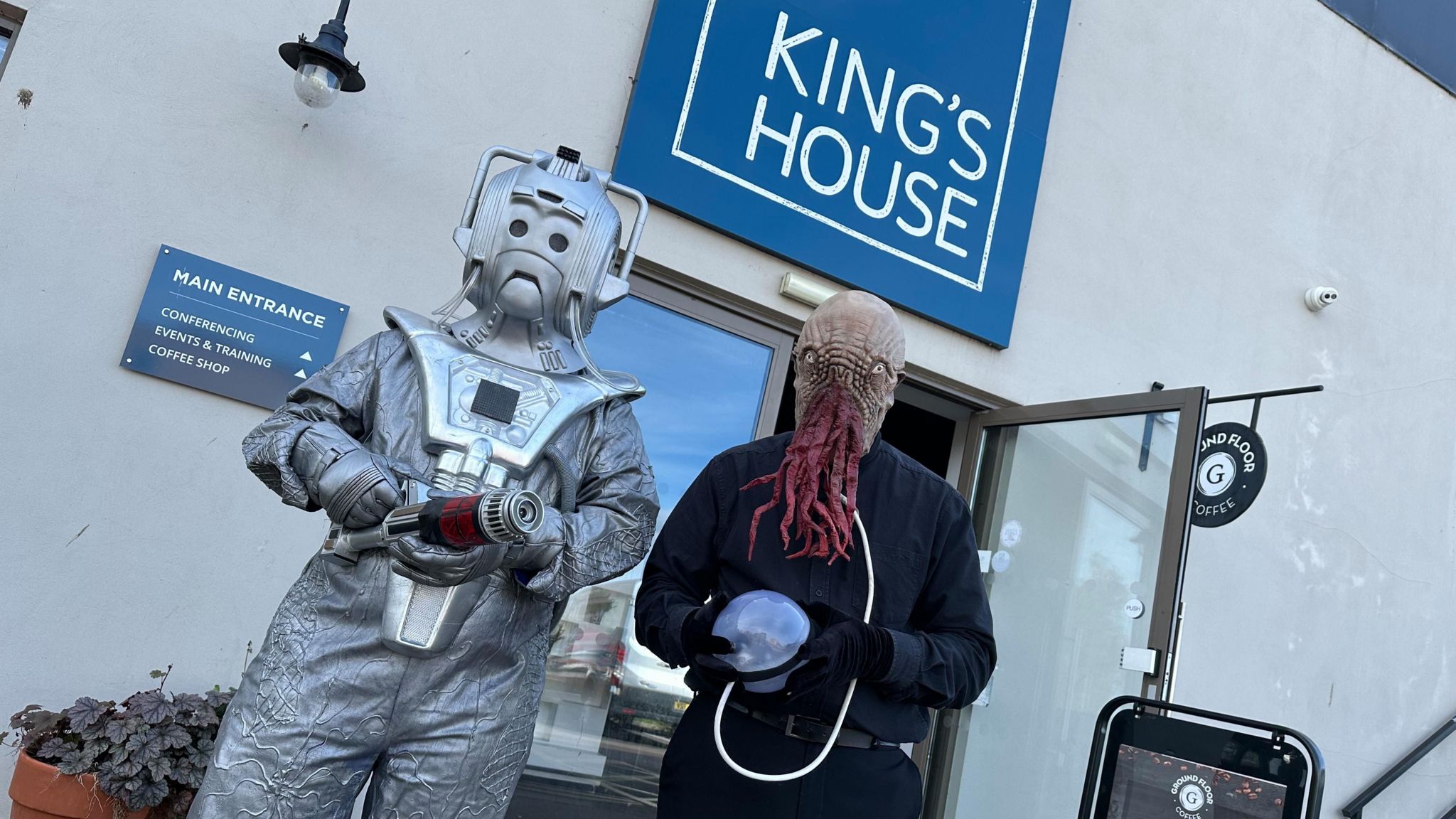 Fan dressed as a Cyberman and Ood outside King's House in bedford