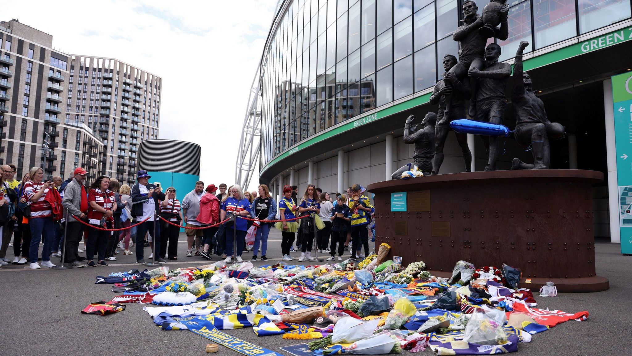 Tributes to Rob Burrow left by Wembley statue