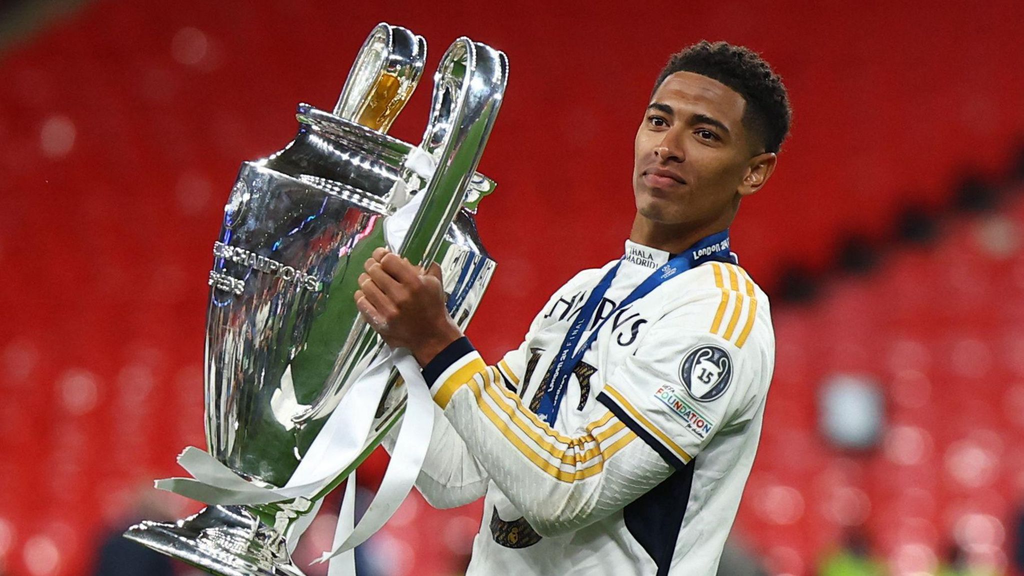 Real Madrid's Jude Bellingam lifts the Champions League trophy