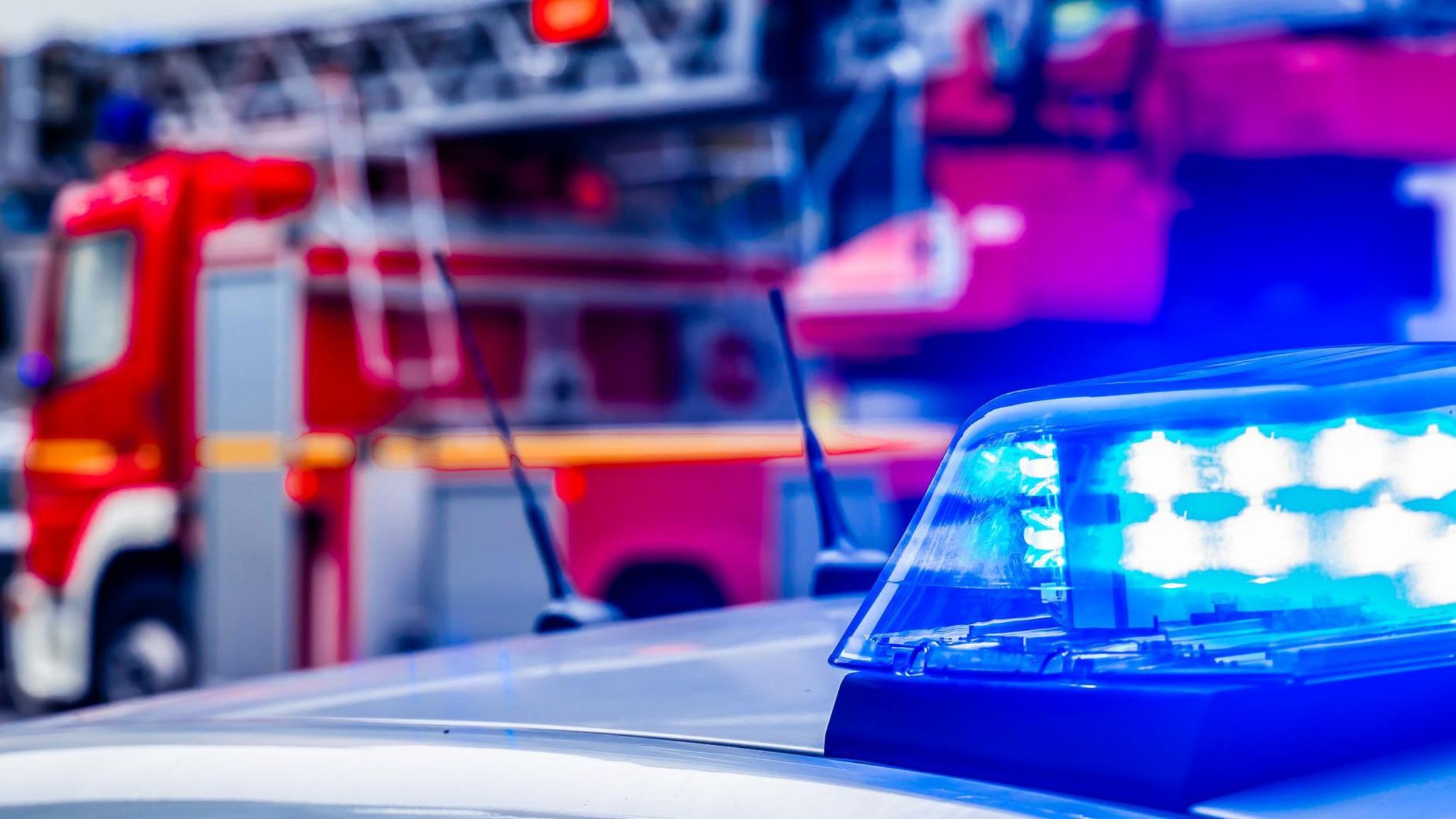 Stock image of a blue light and a fire engine