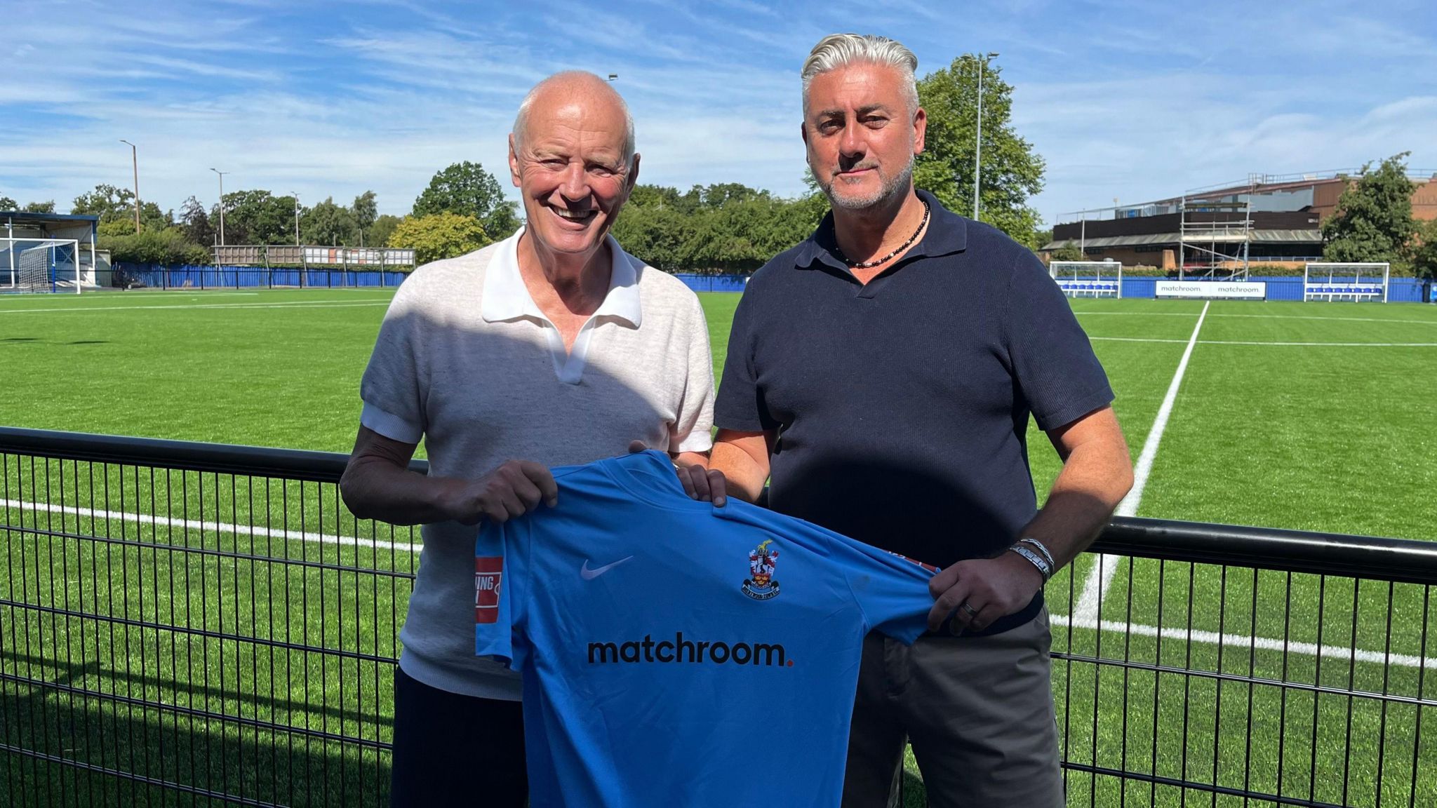 Barry Hearn, Matchroom Sport president, and Brentwood Town FC chairman Jez Dickinson pose with the club's new home shirt