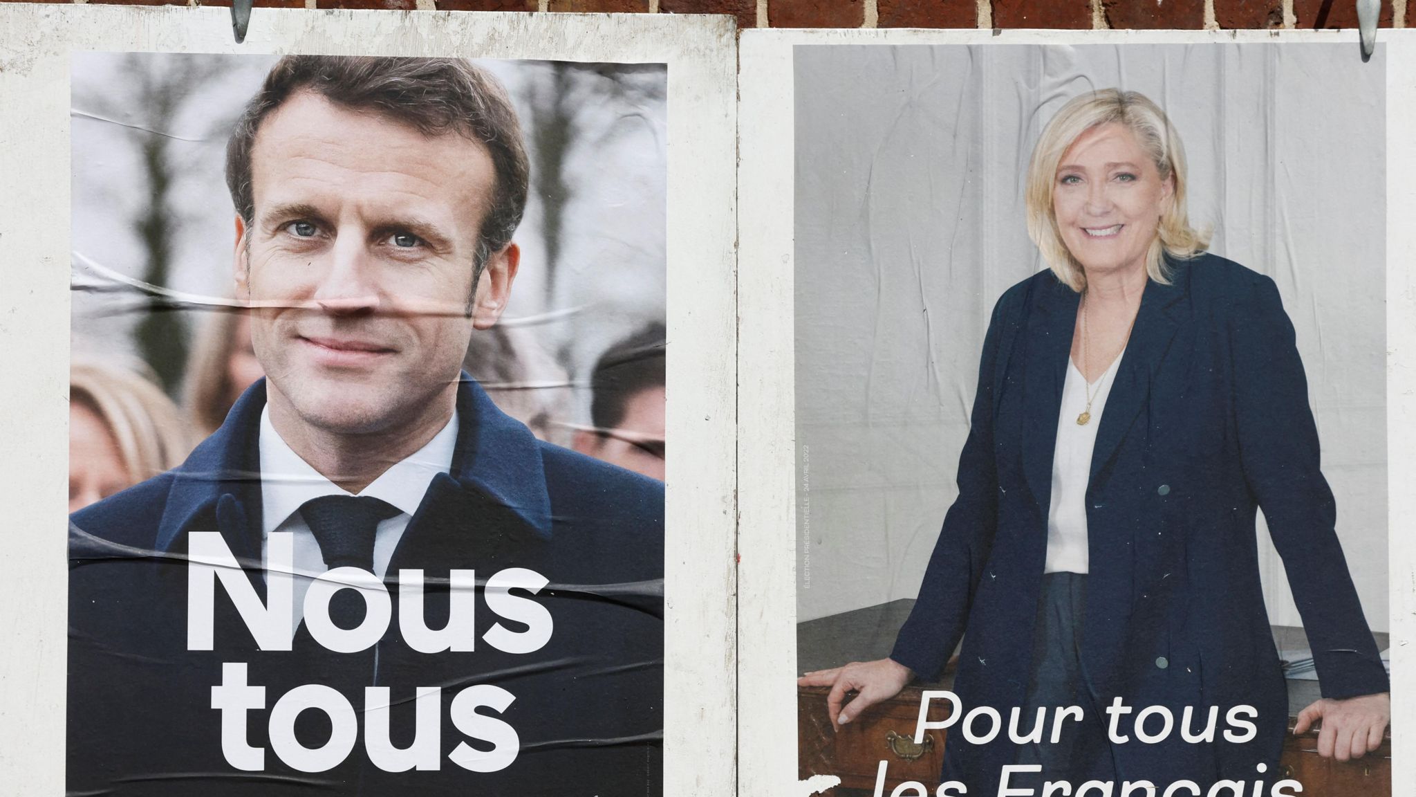 Official campaign posters of French presidential election candidates Marine le Pen, leader of French far-right National Rally (Rassemblement National) party, and French President Emmanuel Macron, 