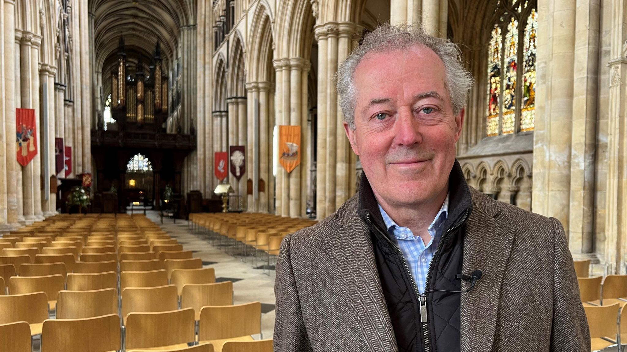 Tim Carlisle standing inside Beverley Minster