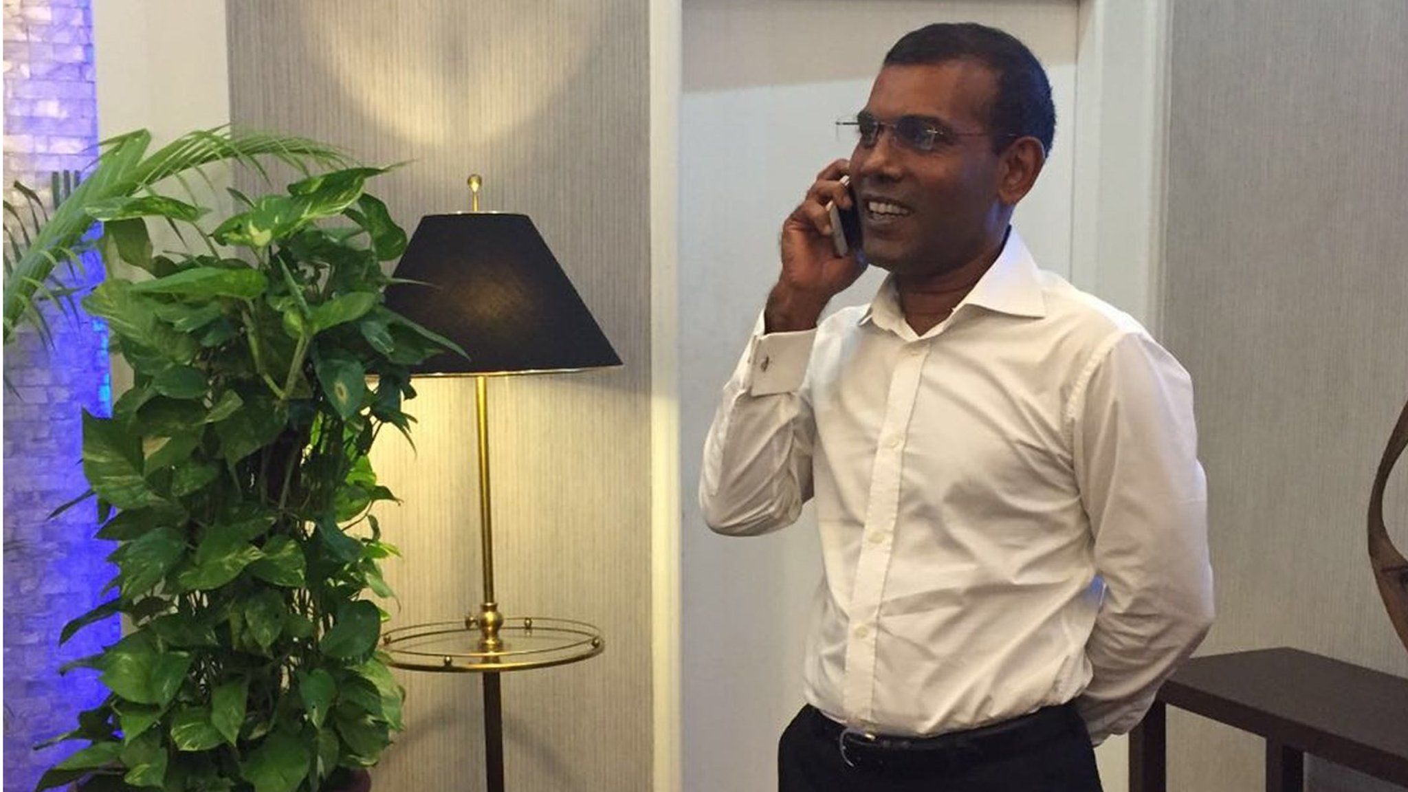 opposition leader Mohamed Nasheed talks on the phone as he prepares to leave the Maldives (MDP handout) (18 January 2016)