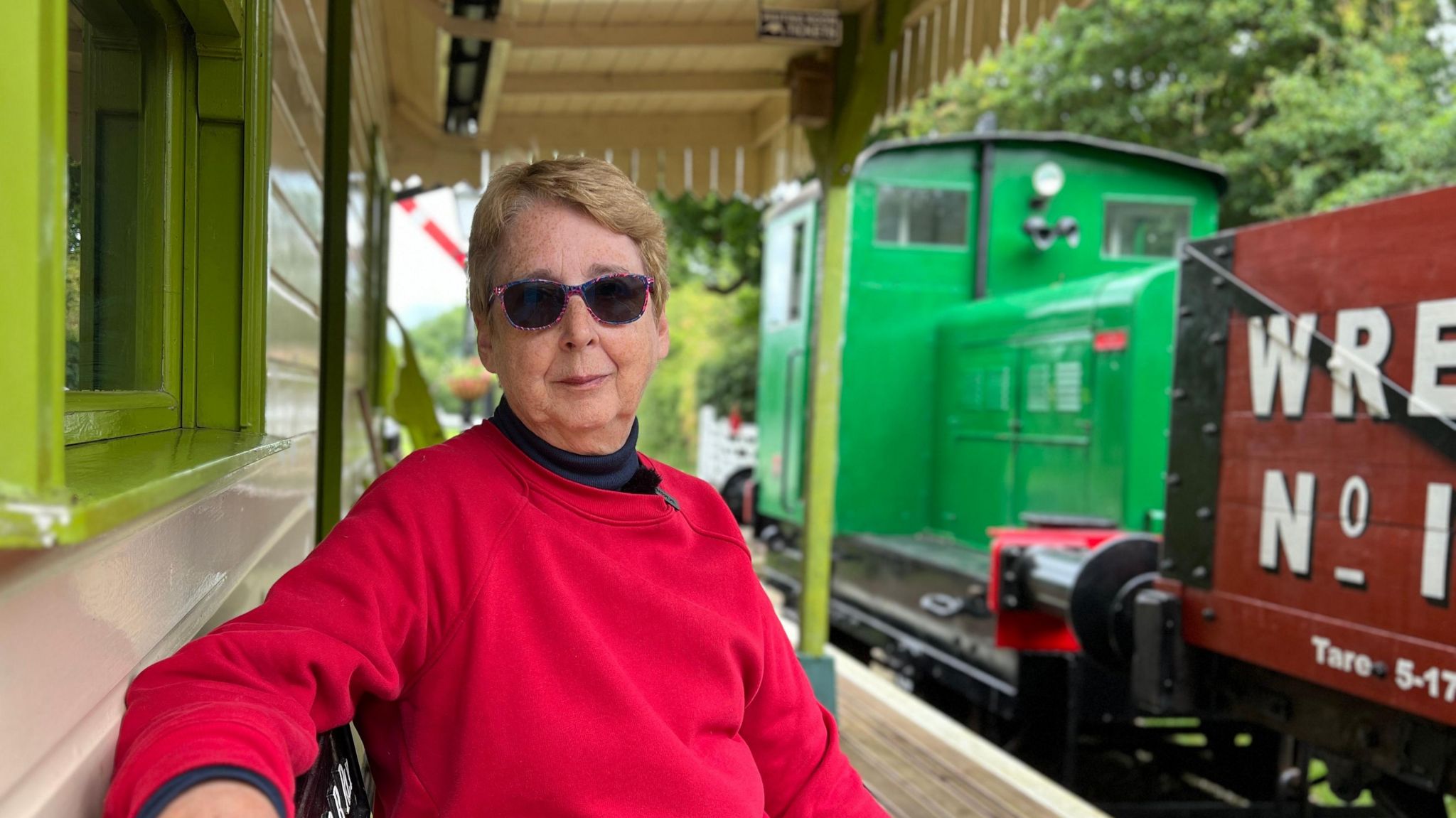 Elizabeth Shutt sits on the platform of the East Wressle and Brind Railway