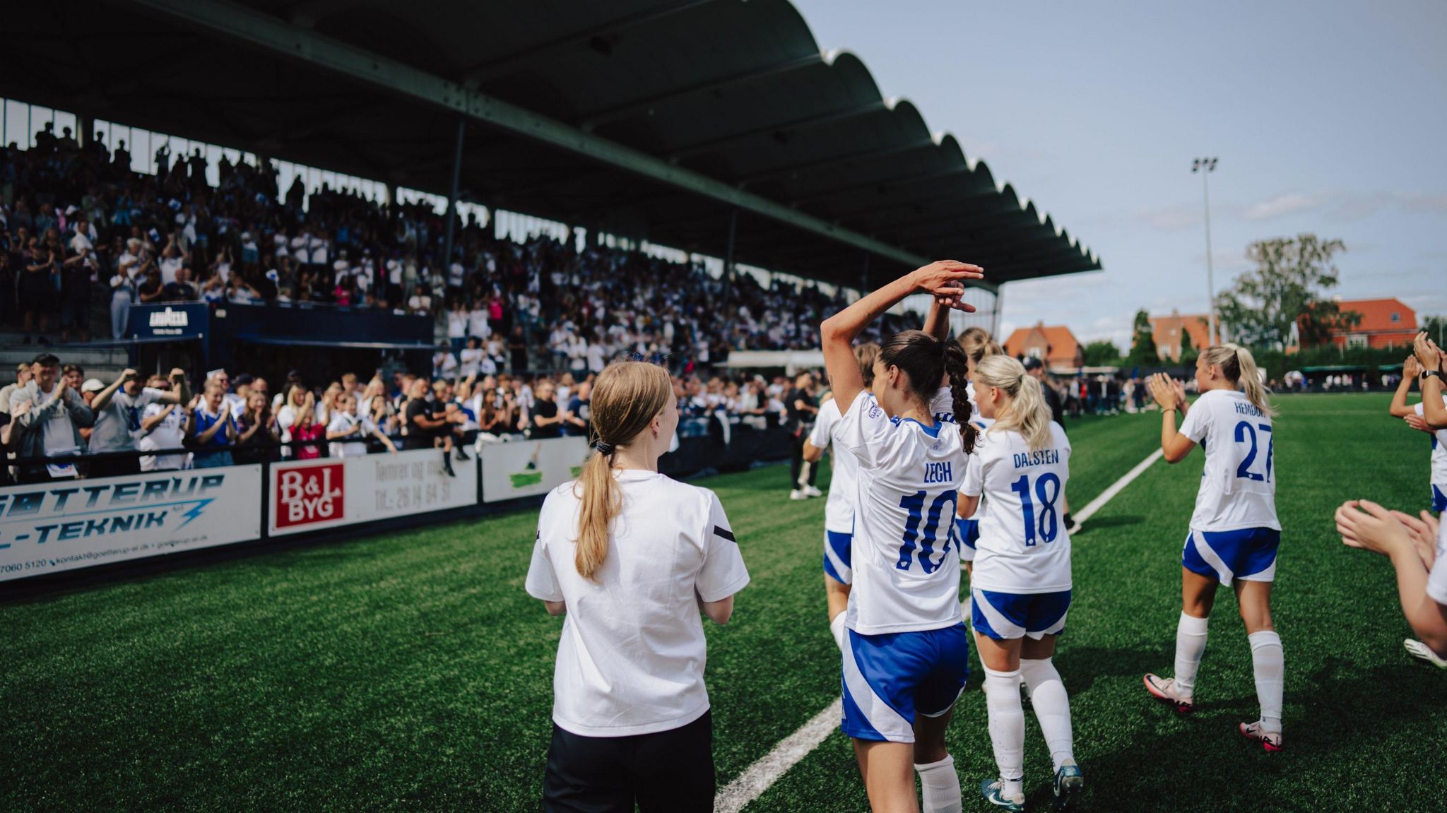 Copenhagen players celebrate in front of their fans after their first home game