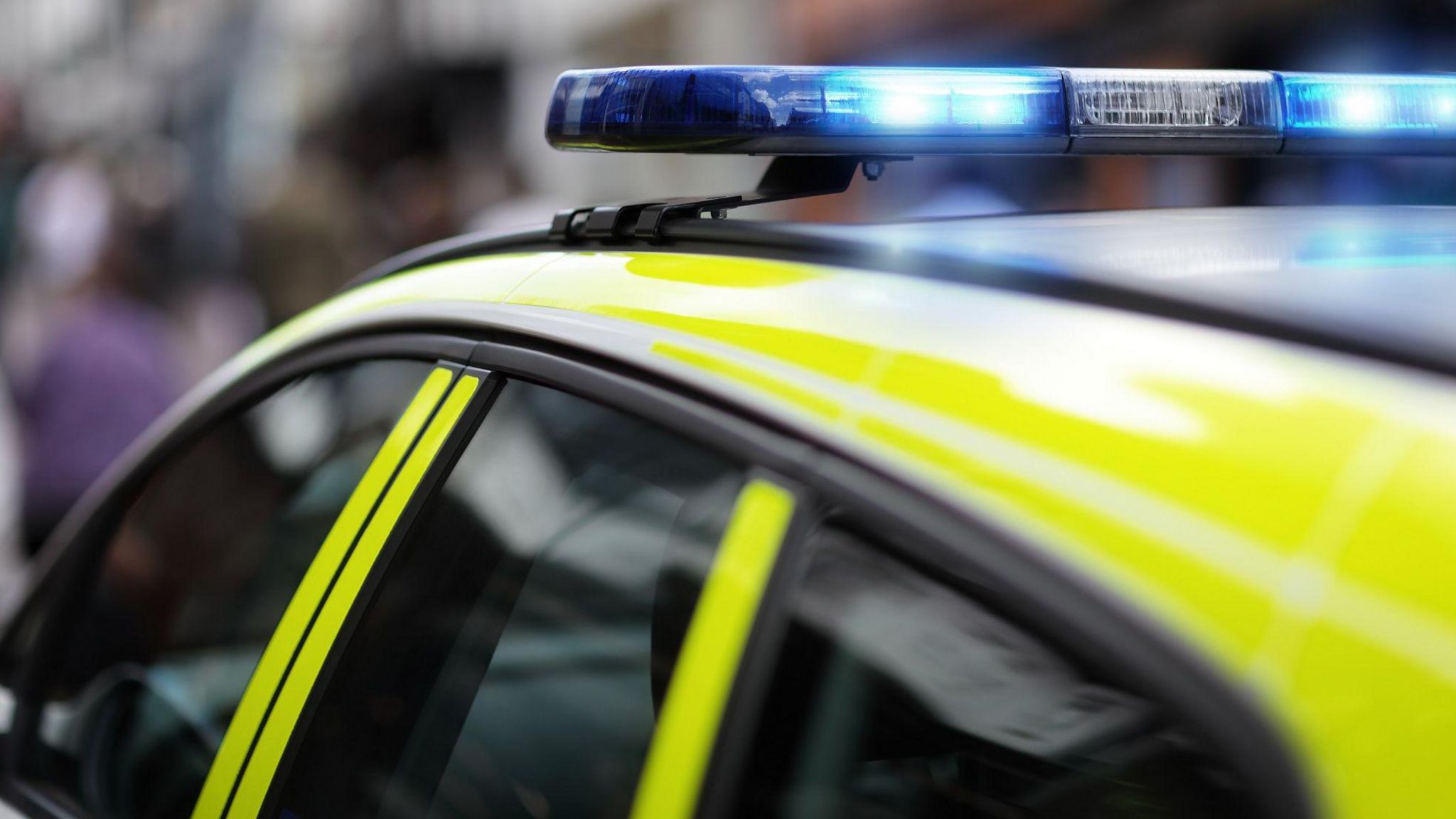 A police car with its blue lights flashing