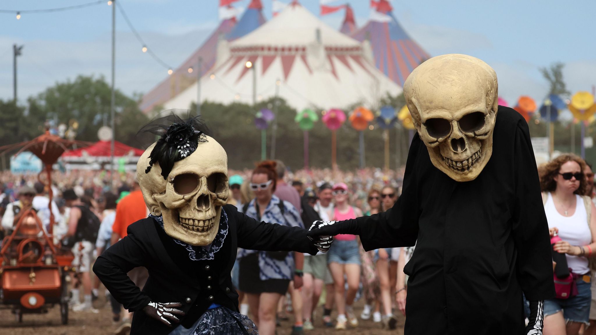 People dressed as skeletons on festival site