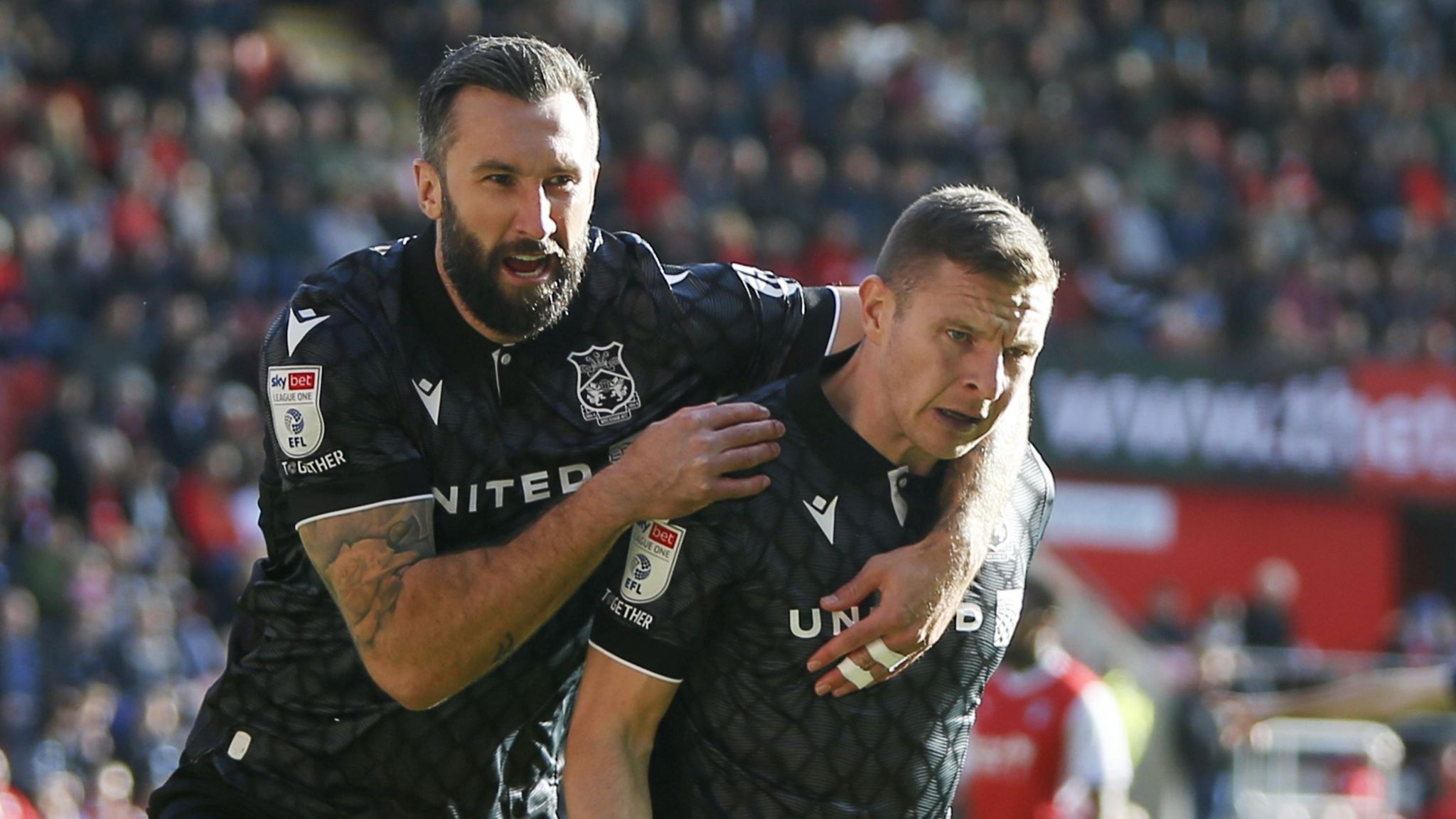 Paul Mullin of Wrexham celebrates scoring against Rotherham