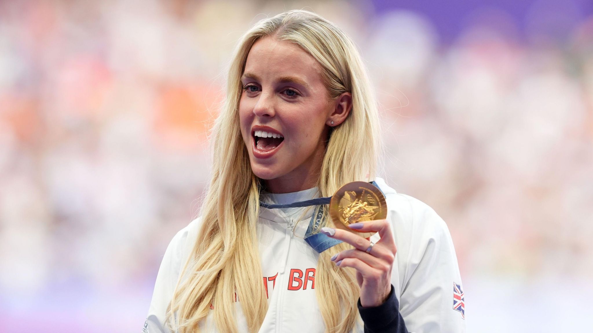 Keely Hodkinson poses with her gold medal