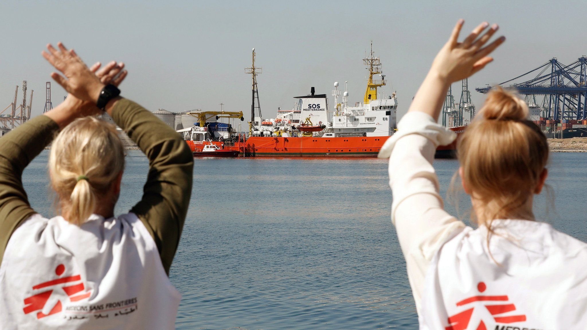 Aid workers welcome the Aquarius as it arrives in Valencia - 17 June