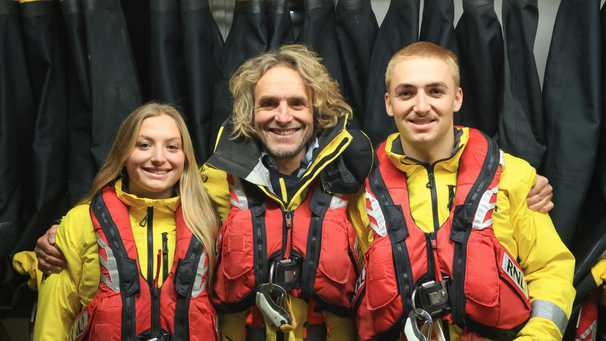 Tamsyn Gorvin, Kirstan Gorvin and Tristan Gorvin in lifejackets all embracing