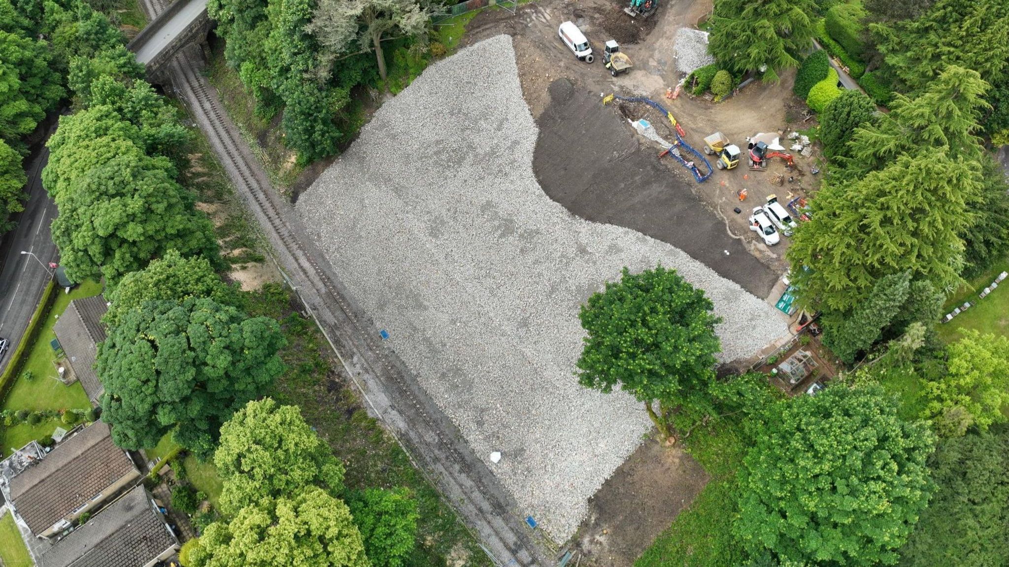 An aerial view showing the site of two houses near the railway line which had to be demolished due to the landslip