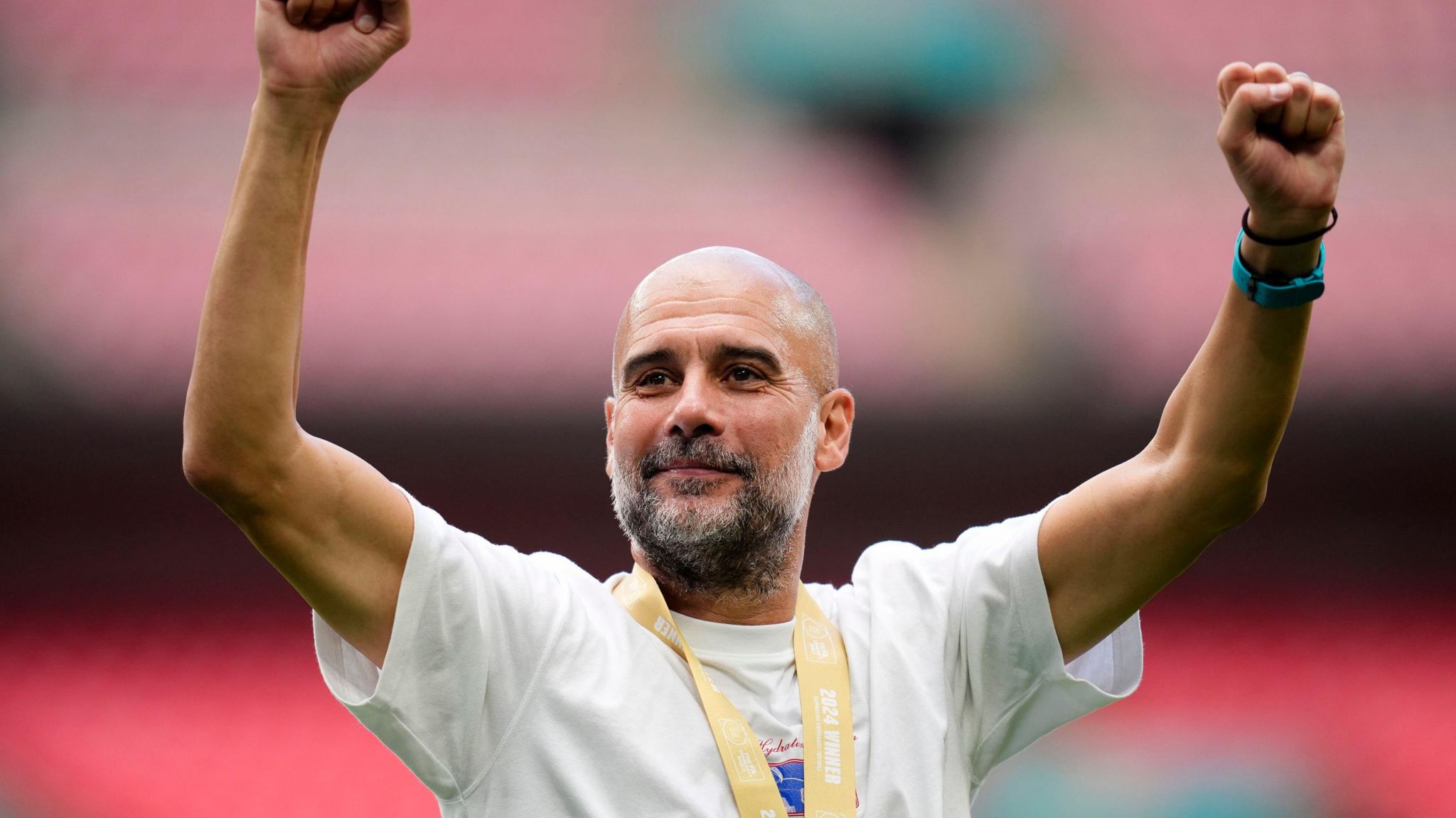 Pep Guardiola raises his arms successful celebration