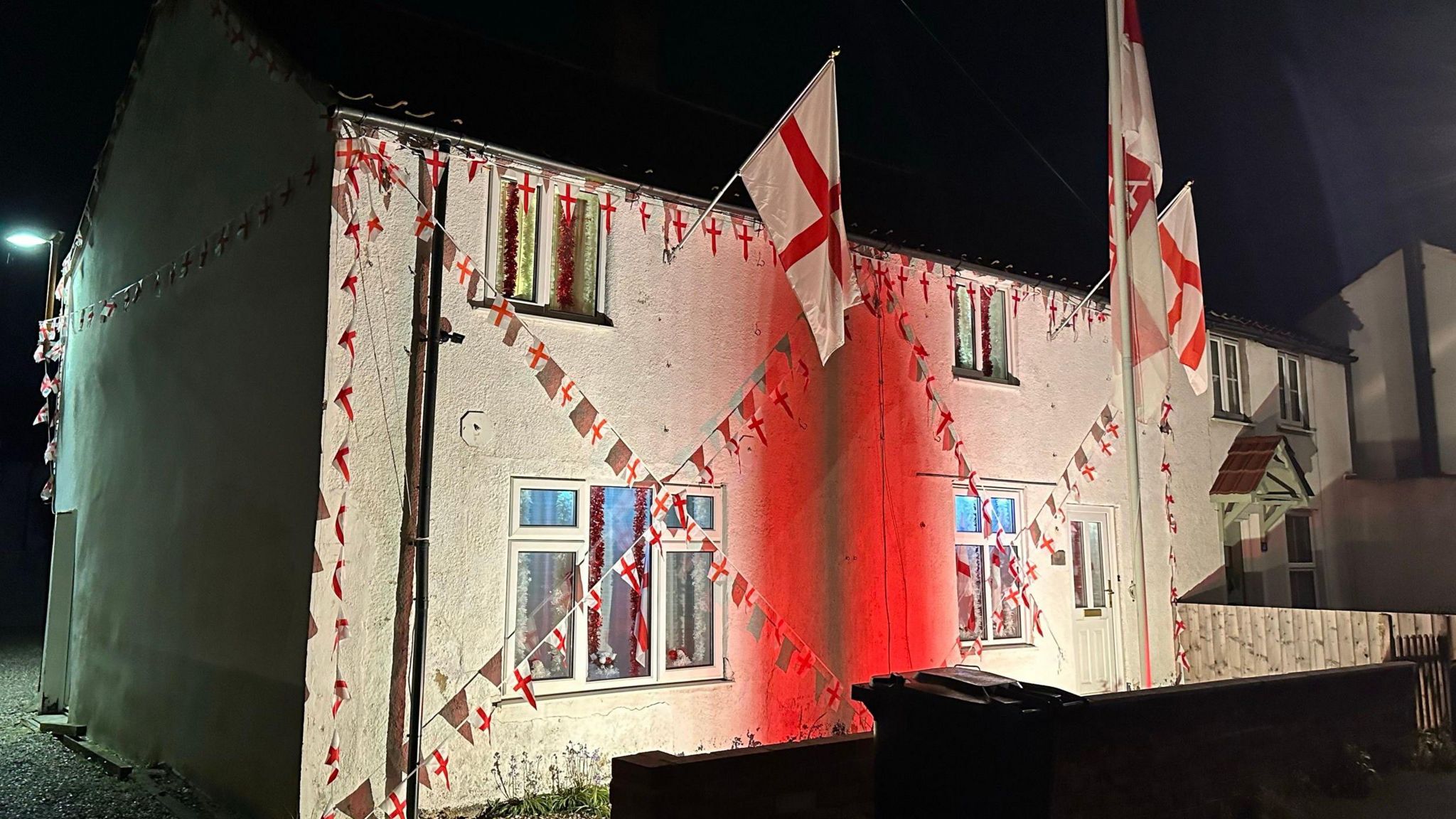 The house with a red spotlight on it