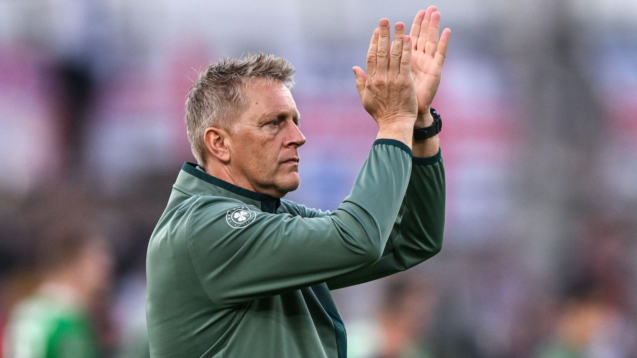 Heimir Hallgrimsson applauds the fans at full-time