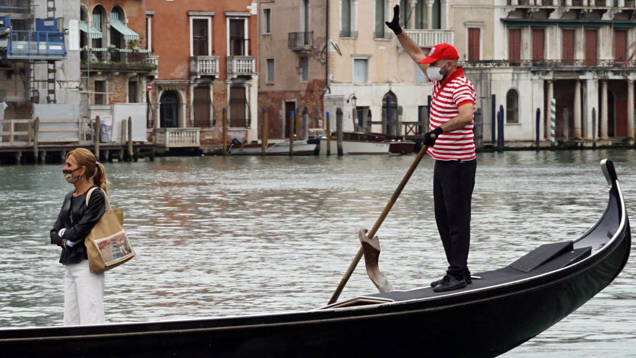 A gondolier on the Grand Canal in Venice, Italy, 18 May 2020