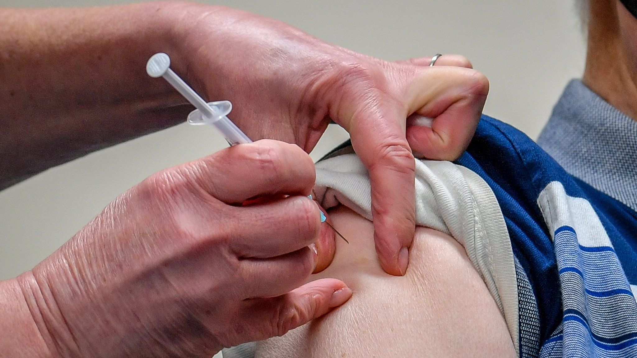 A patient receives the Astra Zeneca/Oxford University Covid-19 vaccine in Merthyr Tydfil