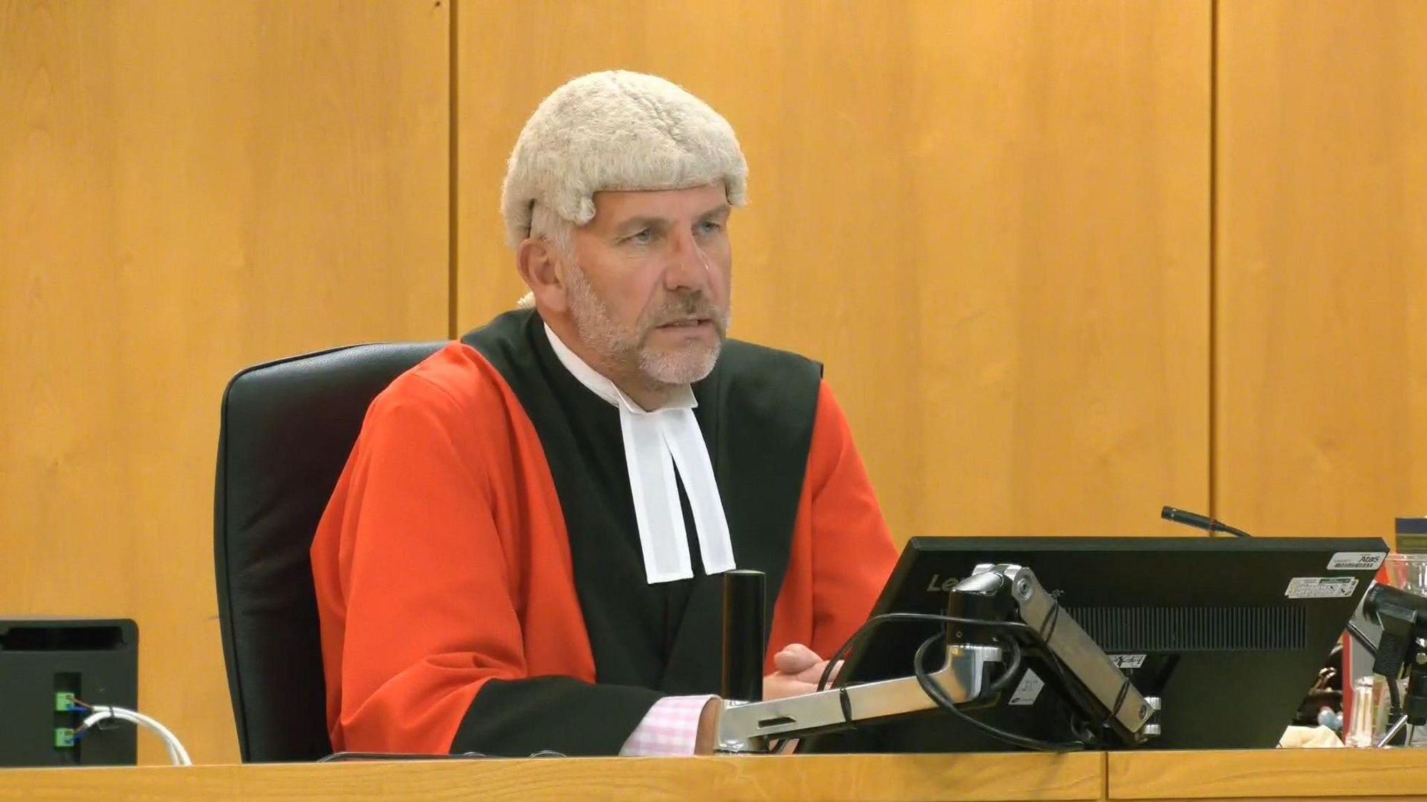 Recorder of Liverpool Judge Andrew Menary KC pictured at Liverpool Crown Court, wearing his judge's red and black robes and wig and speaking in court at the sentencing hearing.