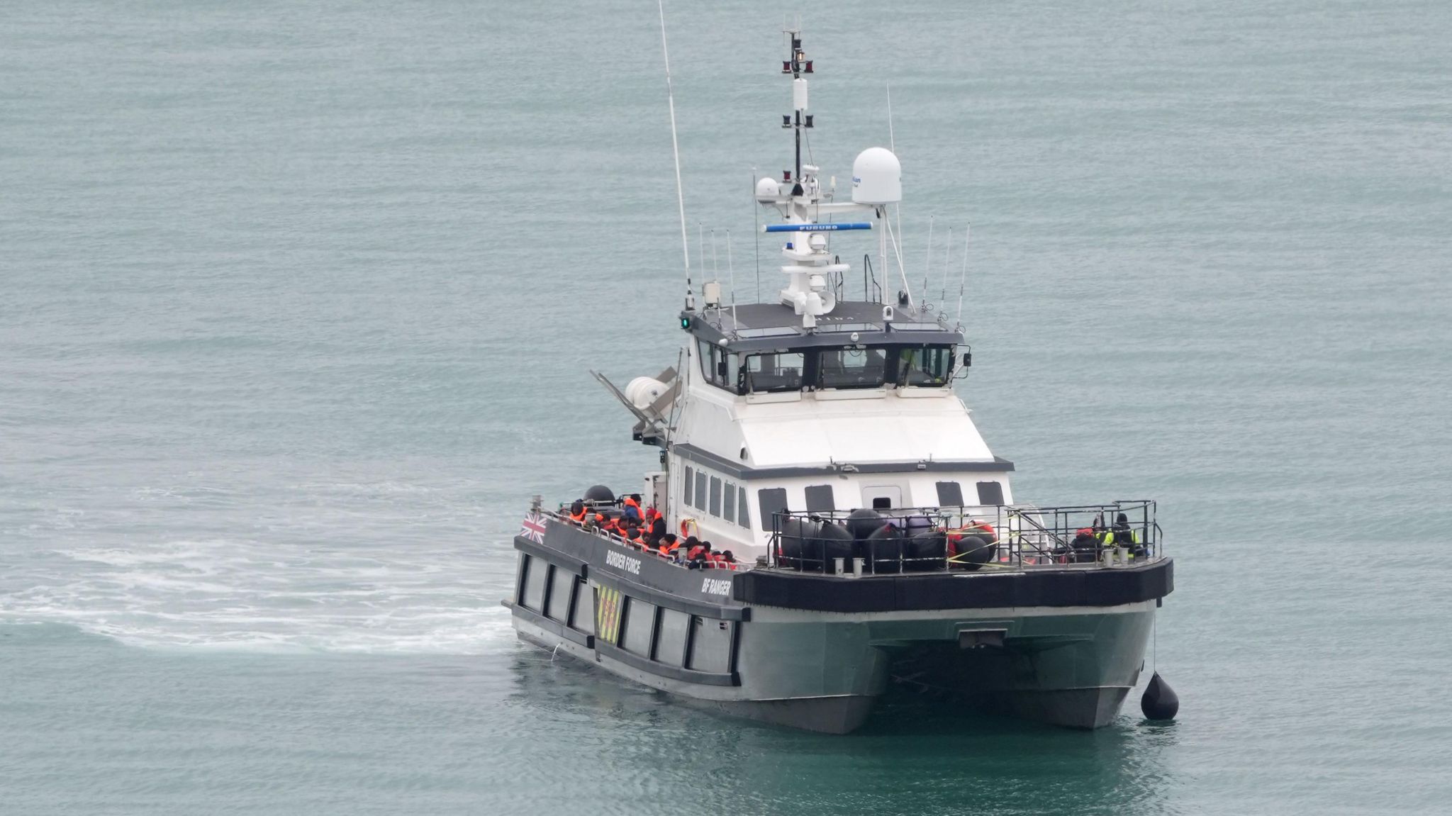 A UK Border Force vessel bringing migrants into Dover