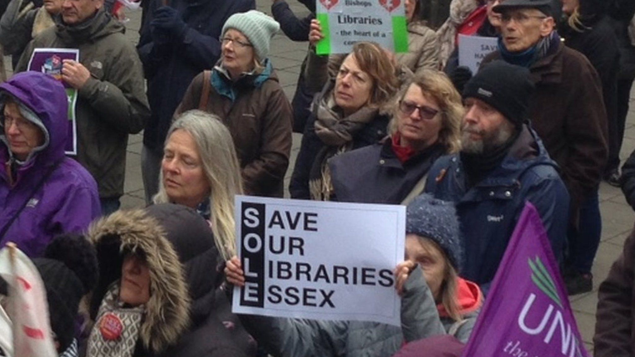 Protesters outside the library meeting