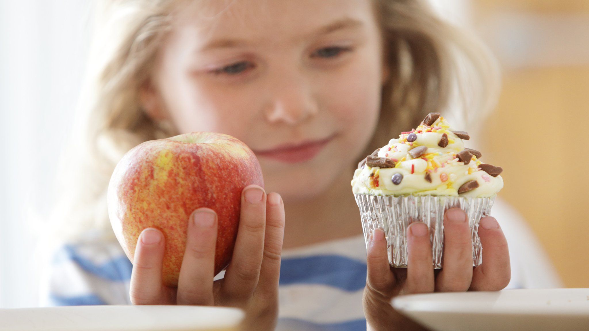 girl-holding-cake-and-apple