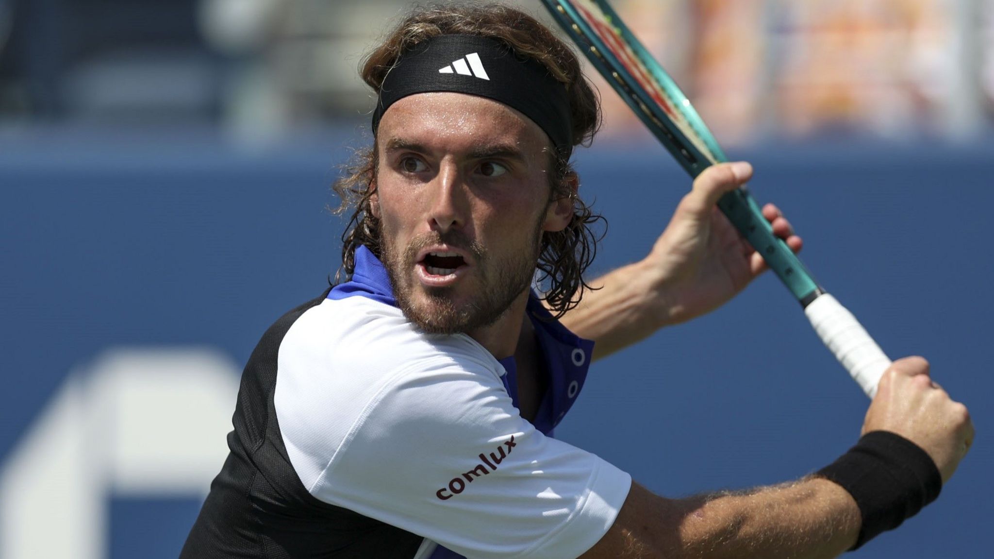 Stefanos Tsitsipas hits a backhand