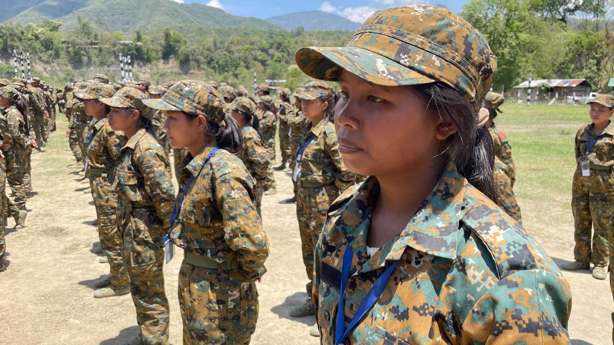 Female recruits are seen at a People Defence Force training ground in combat fatigues