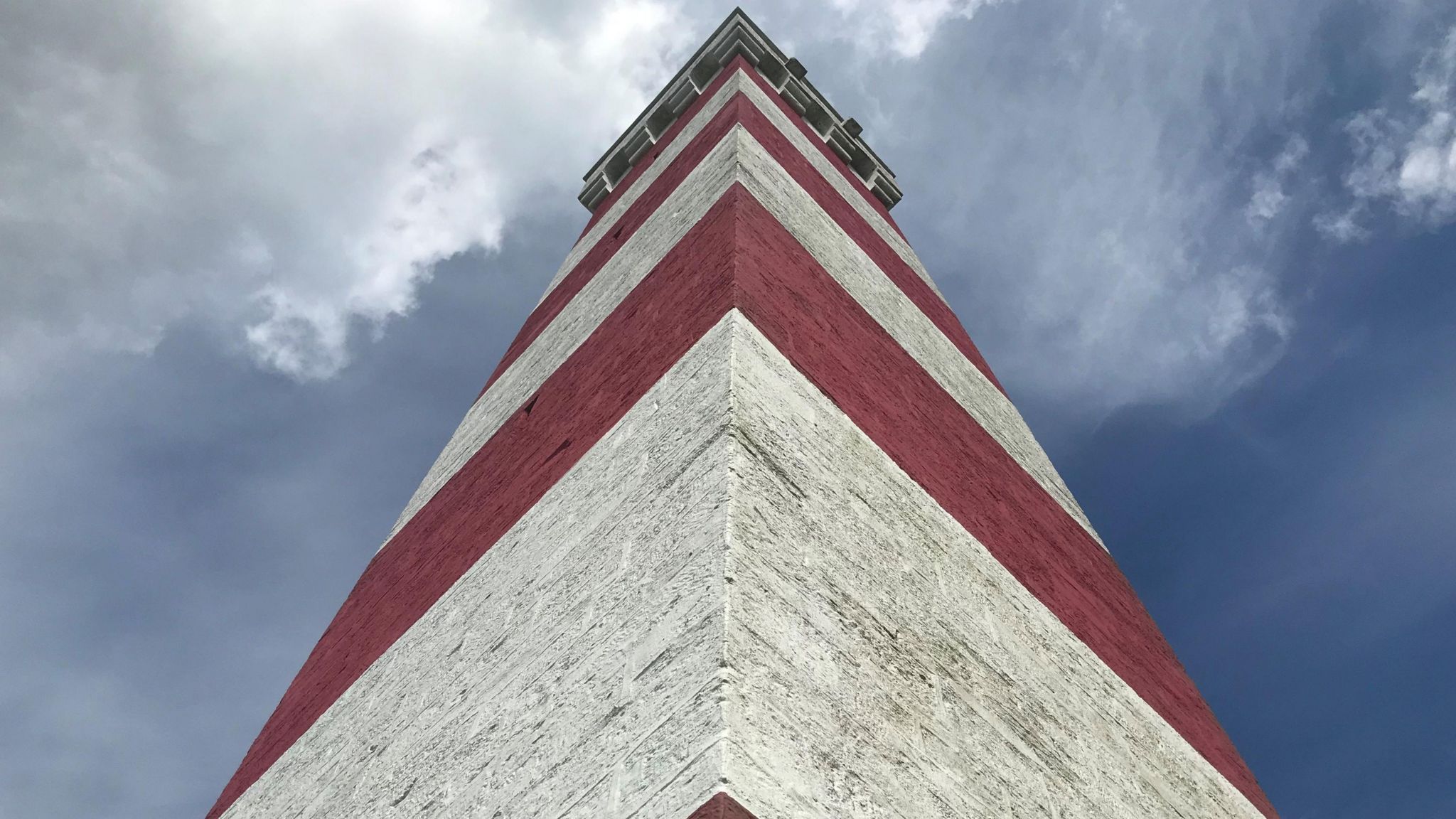 The Gribbin looking up the red and white striped tower towards the sky