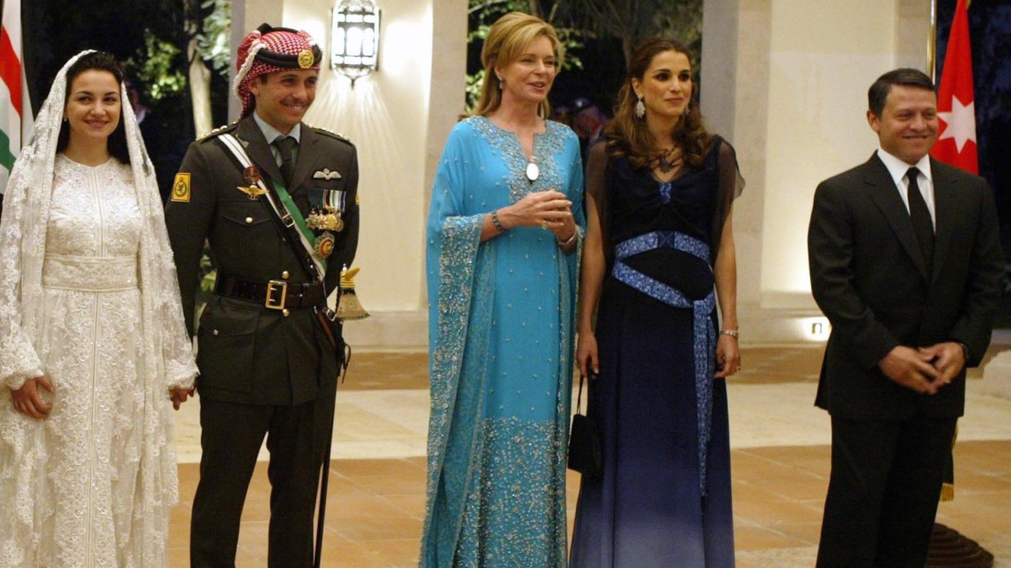 Jordan's King Abdullah II, his wife Queen Rania, Queen Noor, mother of the groom, Crown Prince Hamzah, the groom, his bride Princess Noor, Sherif Asem bin-Nayef and his ex-wife Firouzeh Vokhshouri, parents of the bride, attend the royal wedding on May 27, 2004 in Amman, Jordan