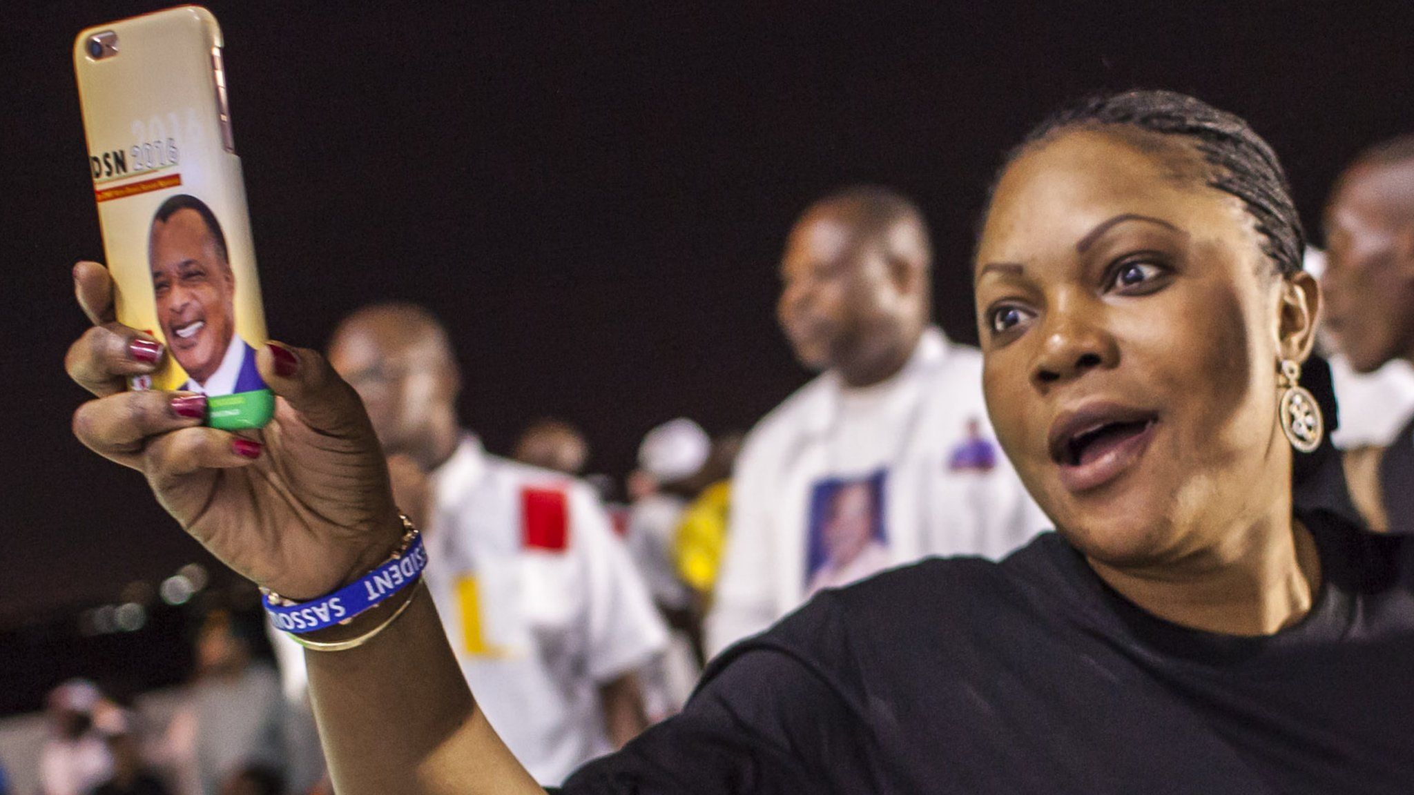 A supporter of incumbent Congolese President Denis Sassou Nguesso celebrates after the announcement of the final results of a presidential election in Brazzaville, Congo-Brazzaville - Wednesday 23 March 2016