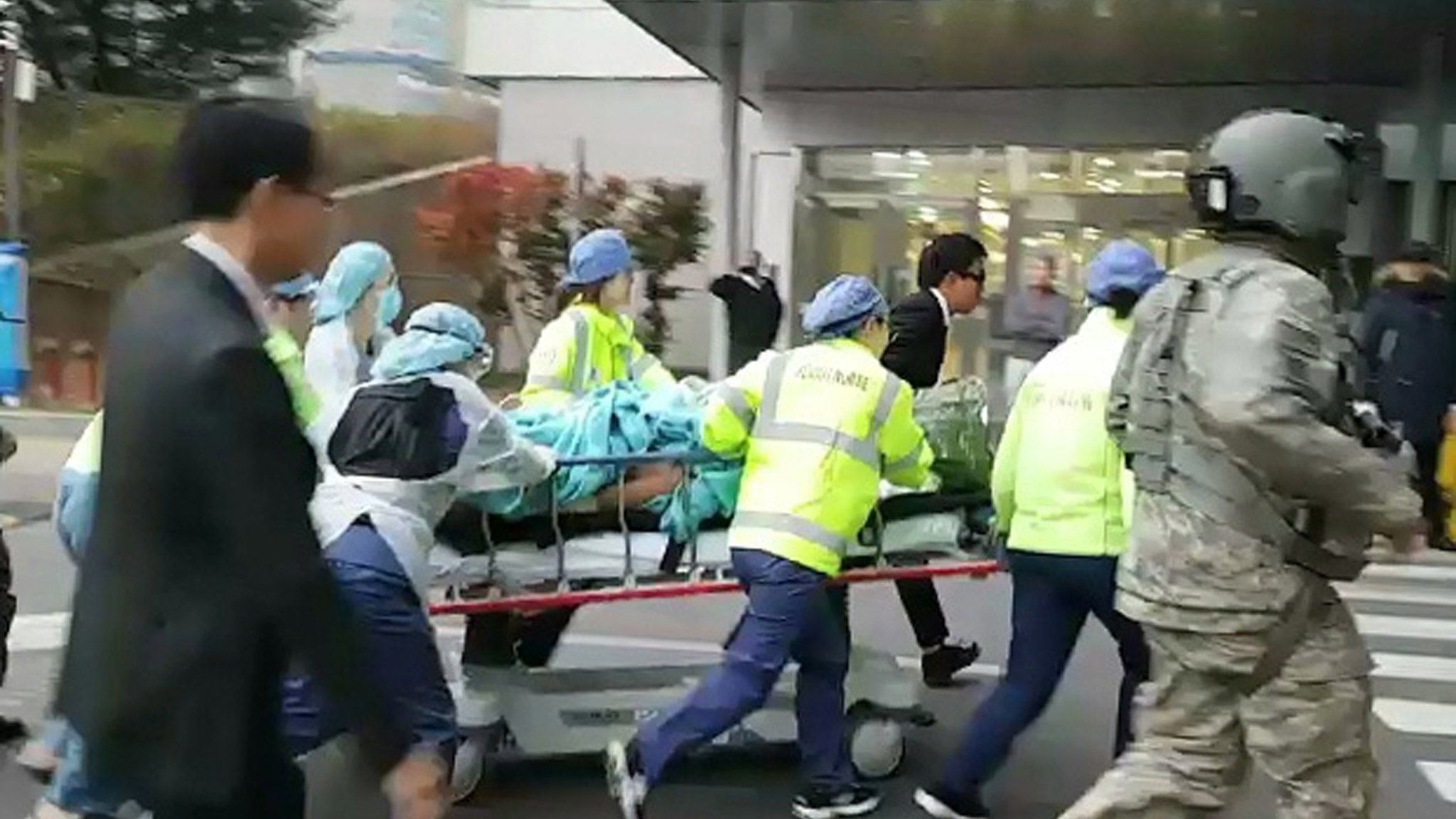 The North Korean soldier is rushed on a stretcher into a hospital in Suwon, Gyeonggi Province, 13 November 2017