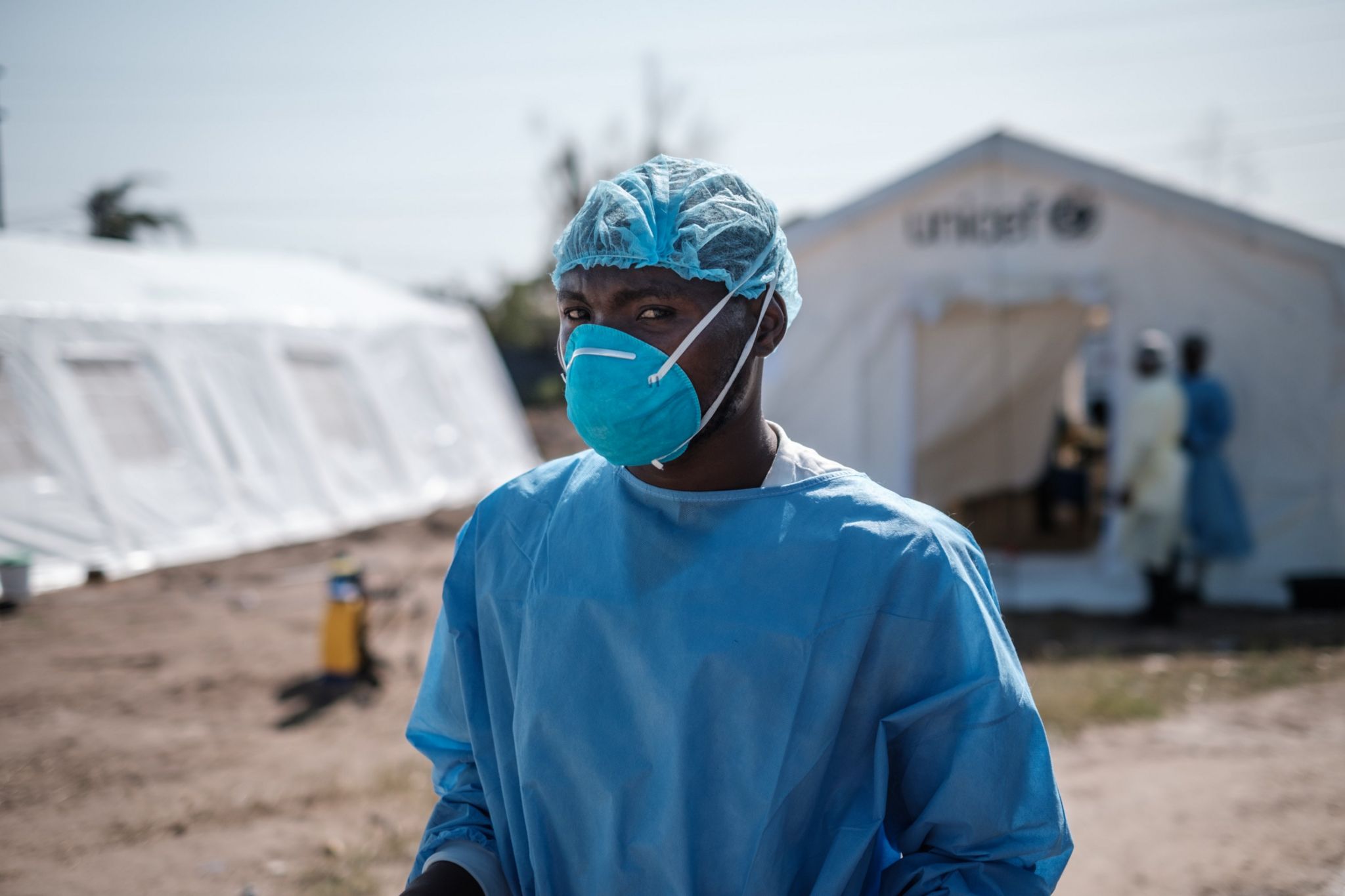 Medical worker outside a treatment centre in Mozambique, March 2019