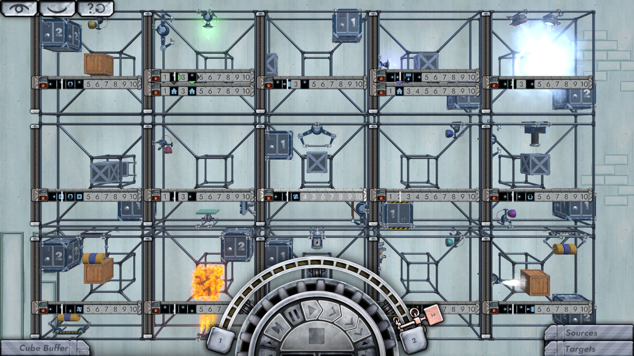 A screenshot showing a five-by-three grid of hollow cubes, each containing a smaller cube at its centre. Various crates and boxes float around the screen. A semi-circular dial at the bottom of the screen with fast-forward and play control buttons are used to control the on-screen action.