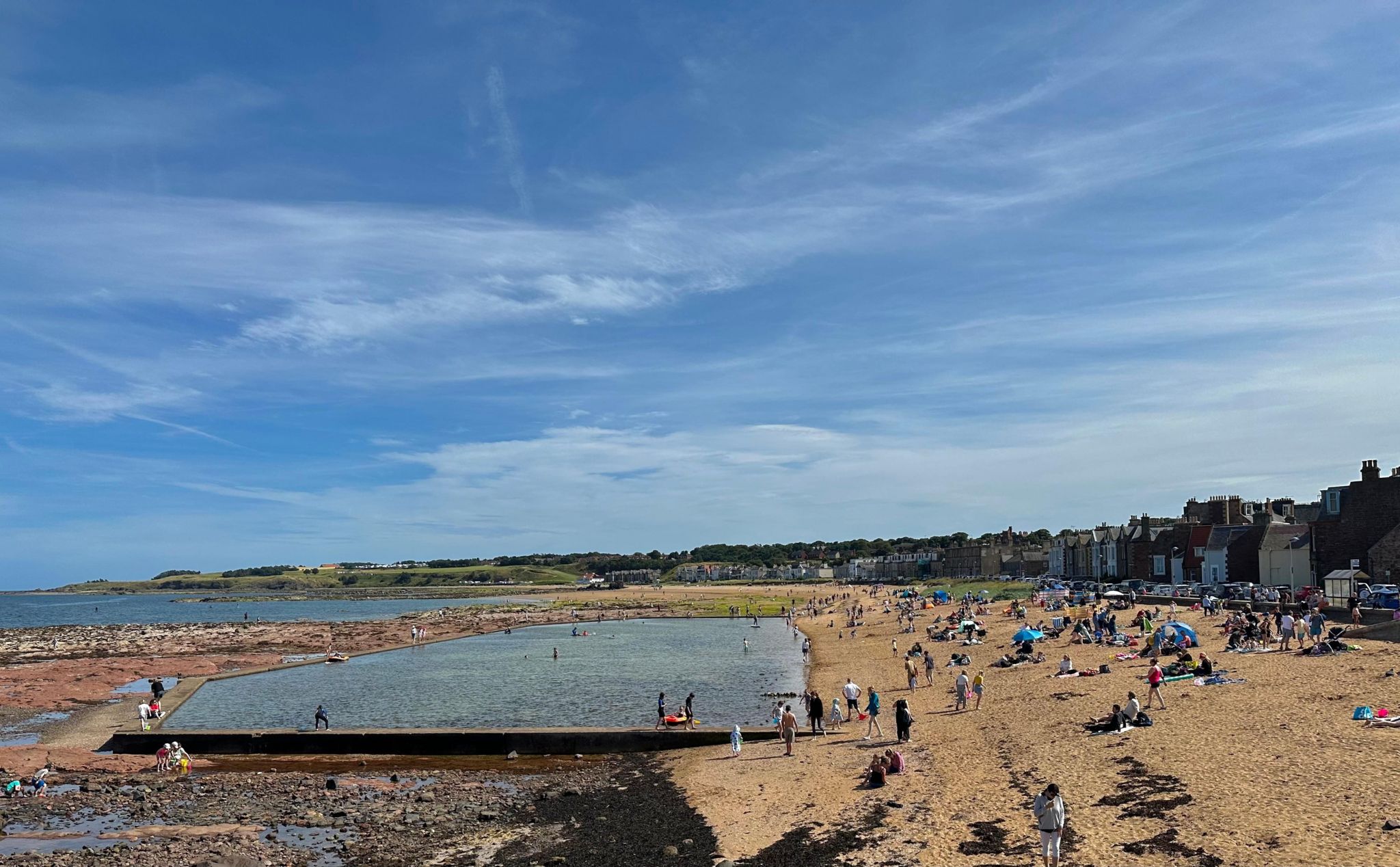 People on the beach in the sunshine in North Berwick