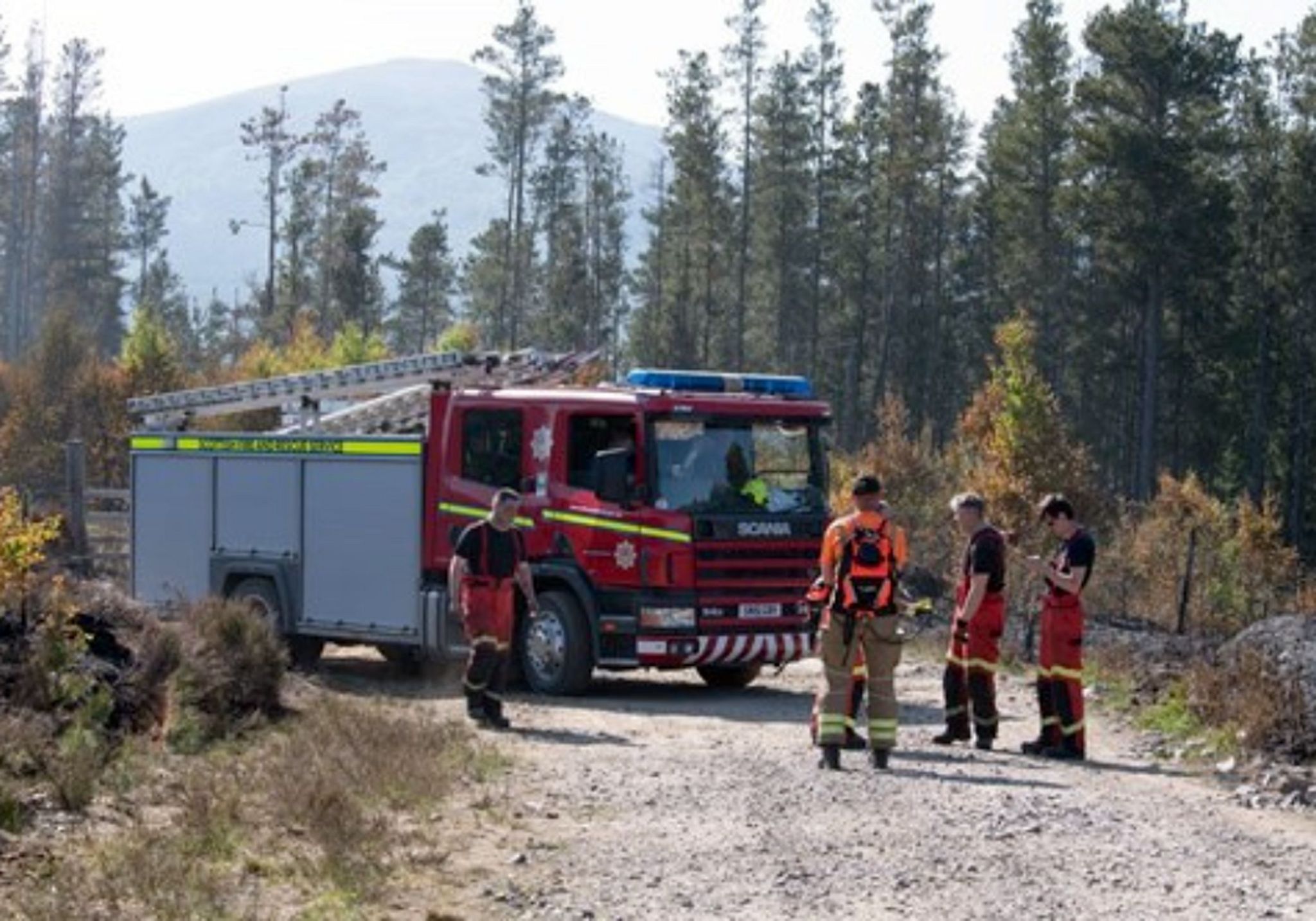 Firefighters at the scene of a wildfire in the Highlands