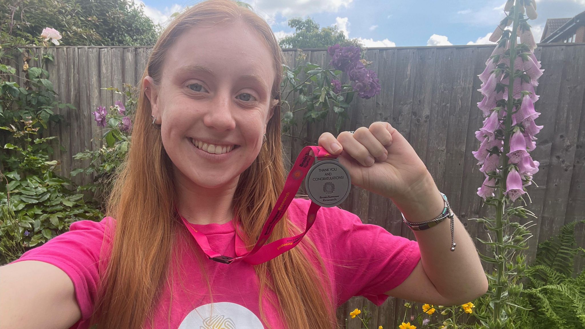 Charlotte Greatorex holding a medal