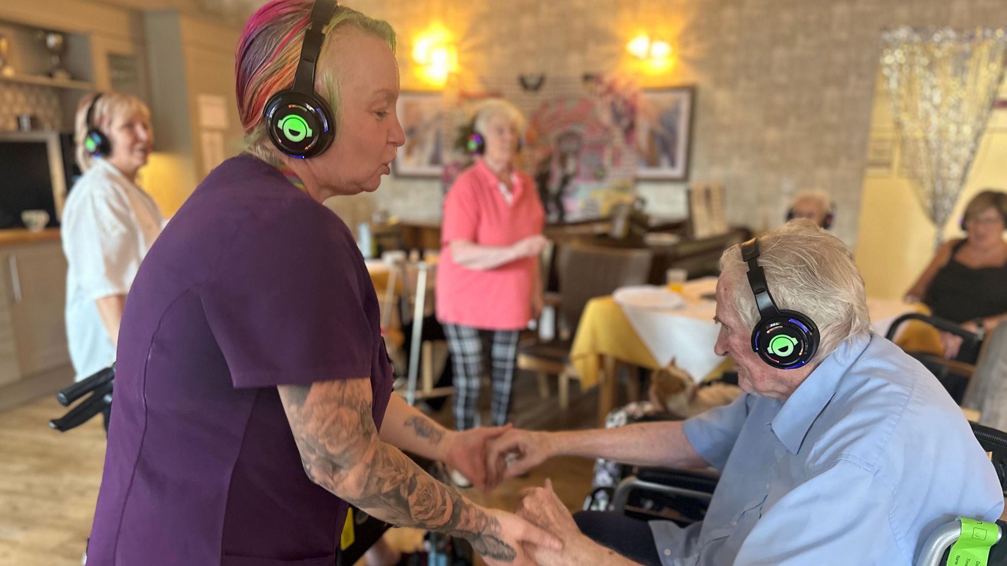 John Worcester, 88 dances with a staff member at the silent disco